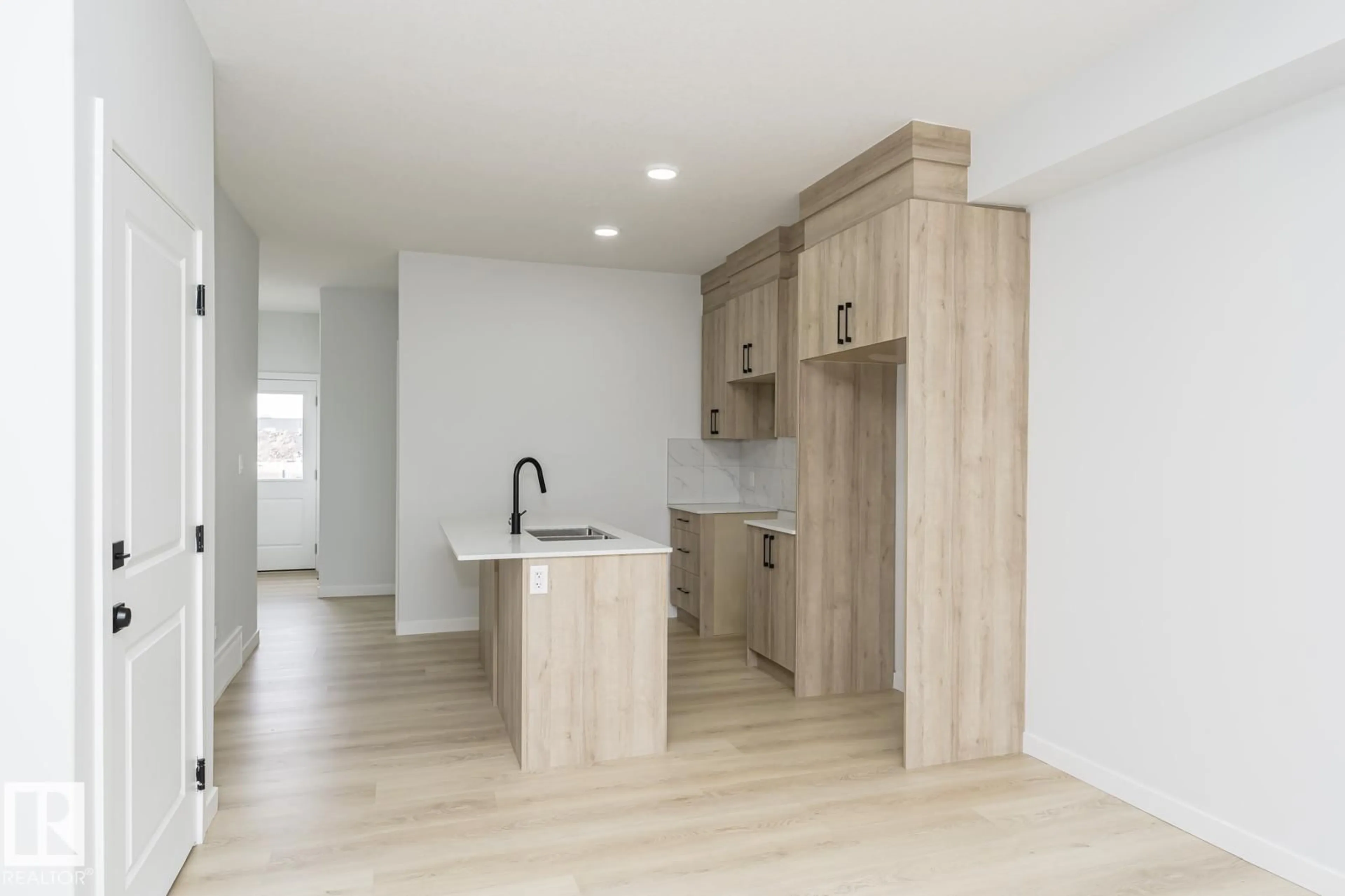 Open concept kitchen, wood/laminate floor for 6371 KING WD, Edmonton Alberta T6W5J3