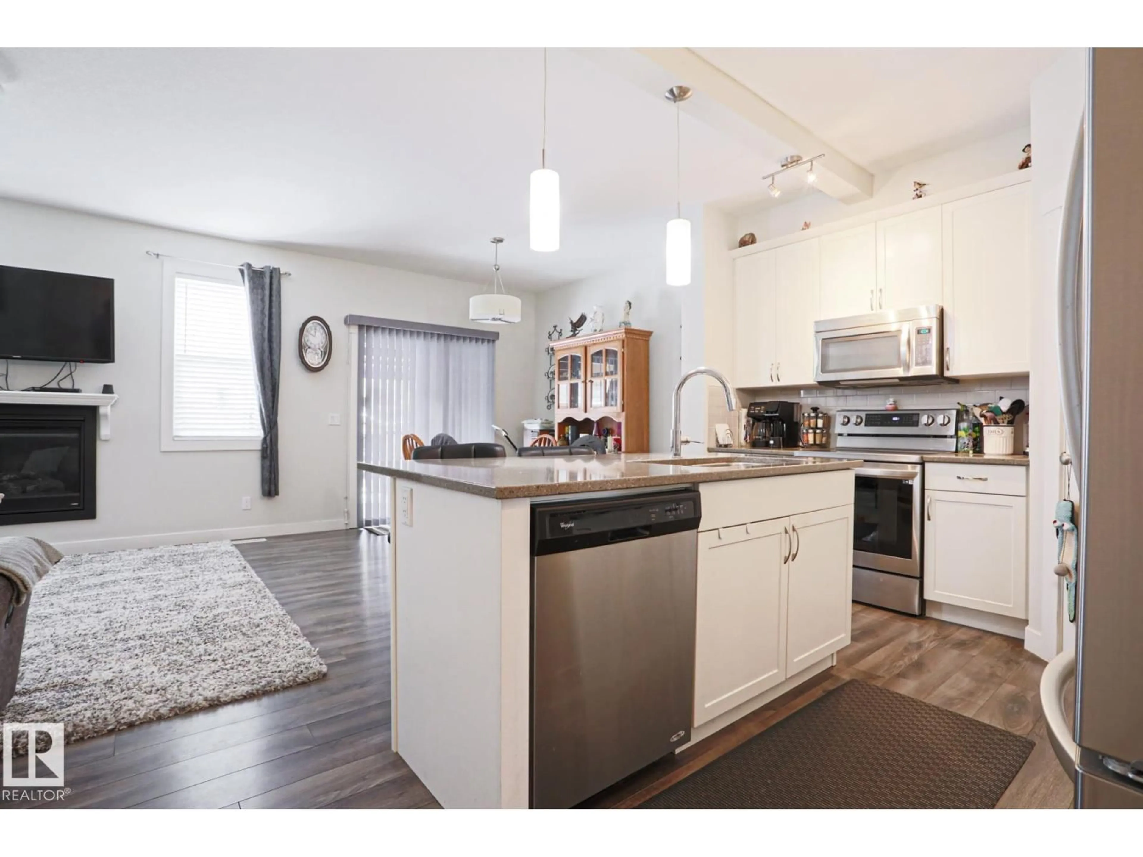 Open concept kitchen, wood/laminate floor for 28 HAZELWOOD LN, Spruce Grove Alberta T7X0R7