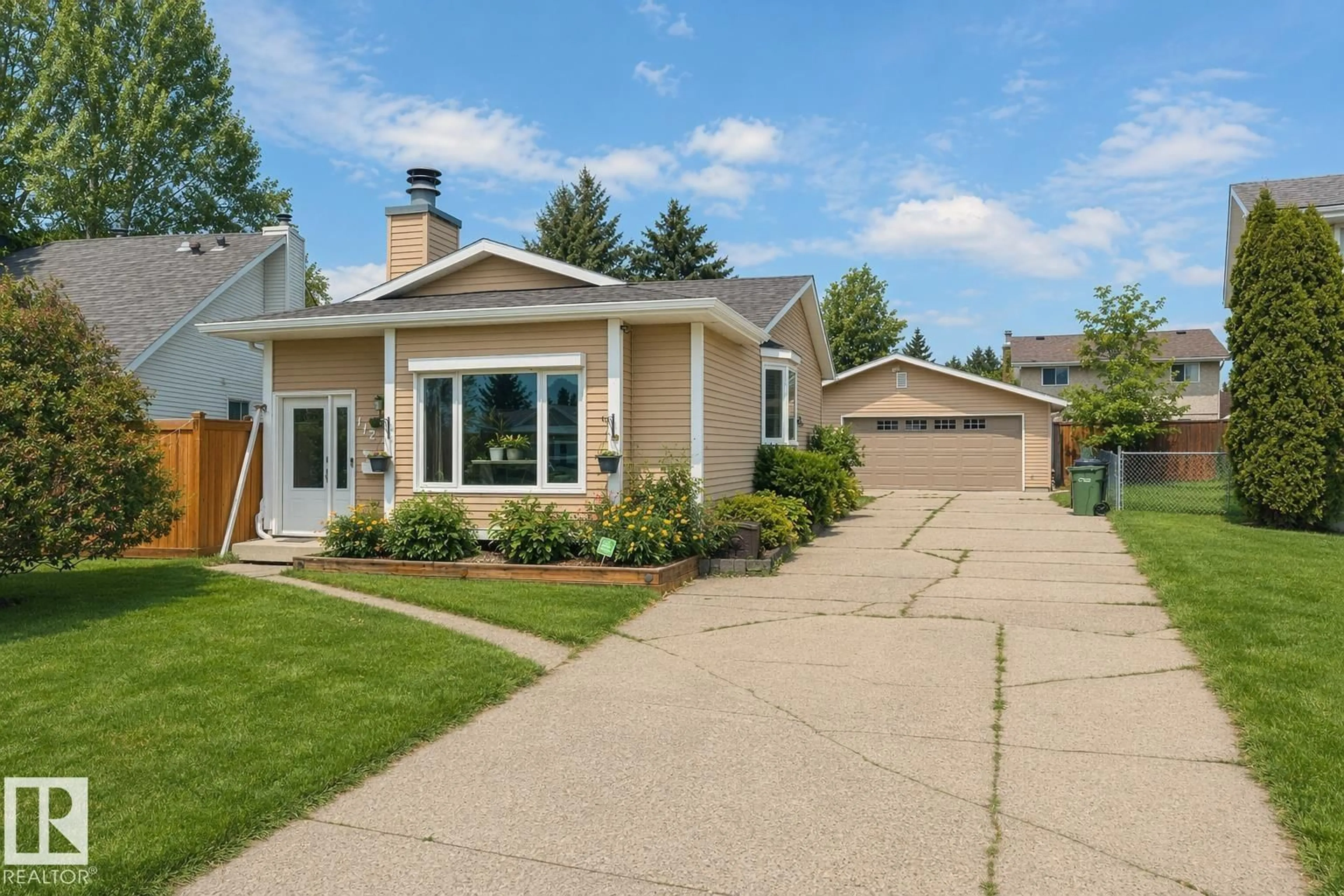 Home with vinyl exterior material, street for 1127 36 ST, Edmonton Alberta T6L2L6