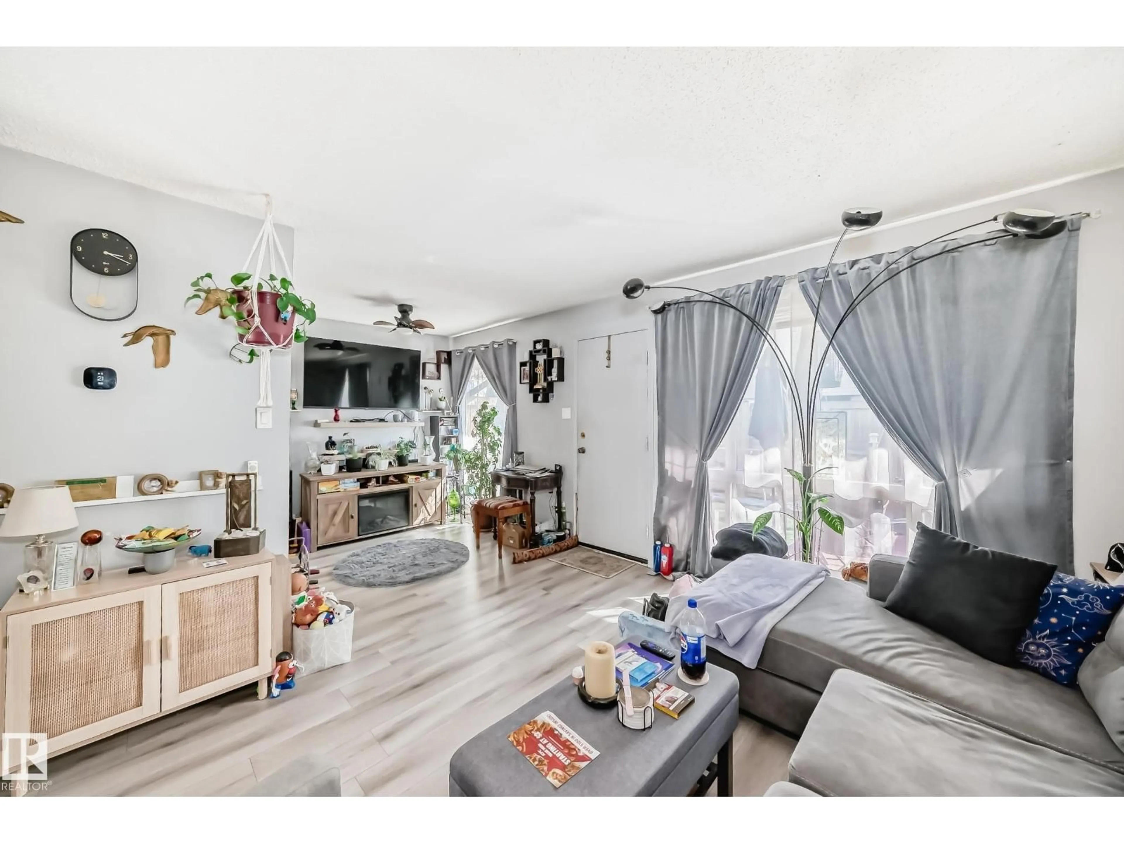 Living room with furniture, wood/laminate floor for 582 ABBOTTSFIELD RD, Edmonton Alberta T5W4R3