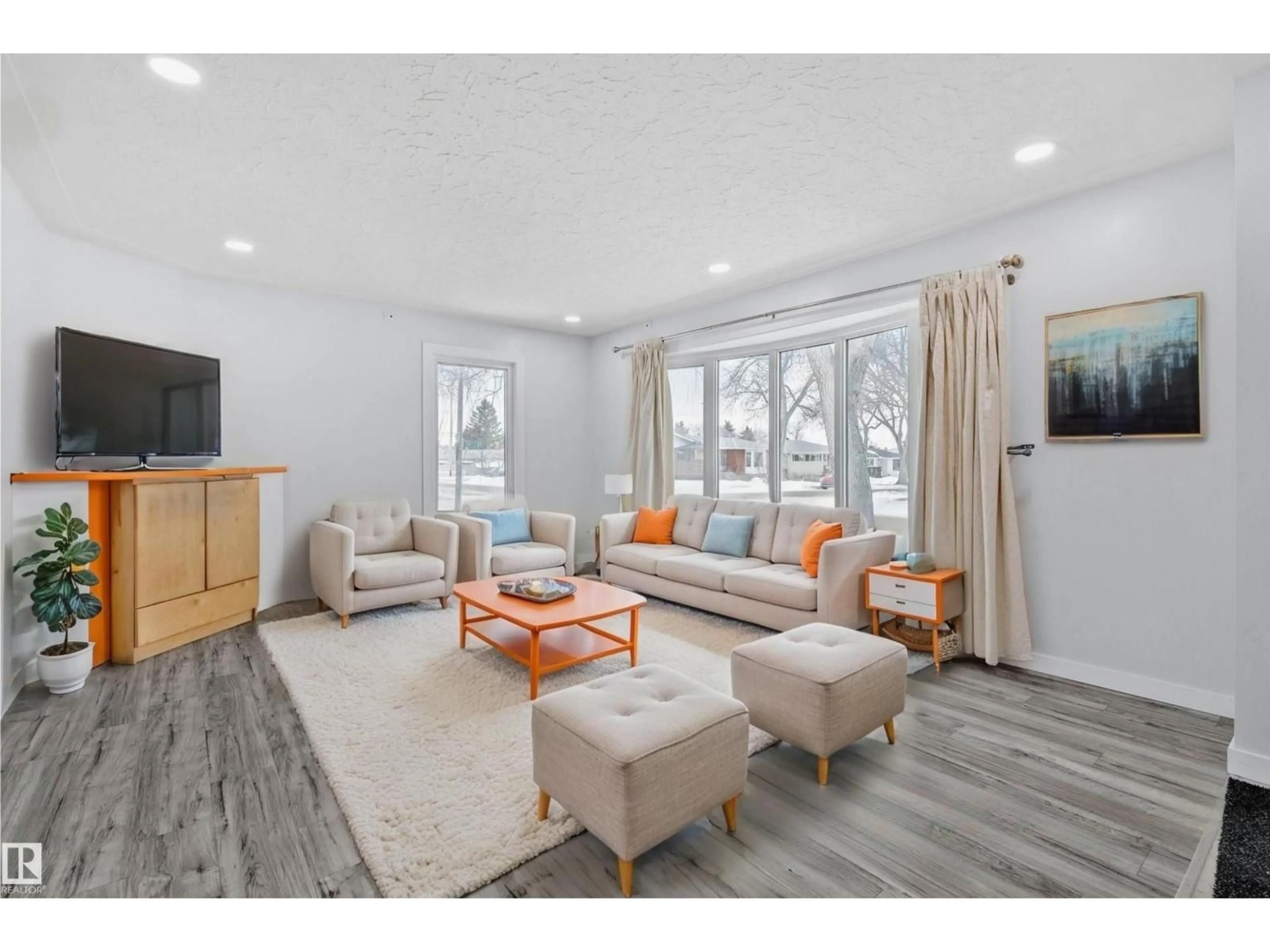 Living room with furniture, wood/laminate floor for NW - 12002 37 ST, Edmonton Alberta T5W2C3