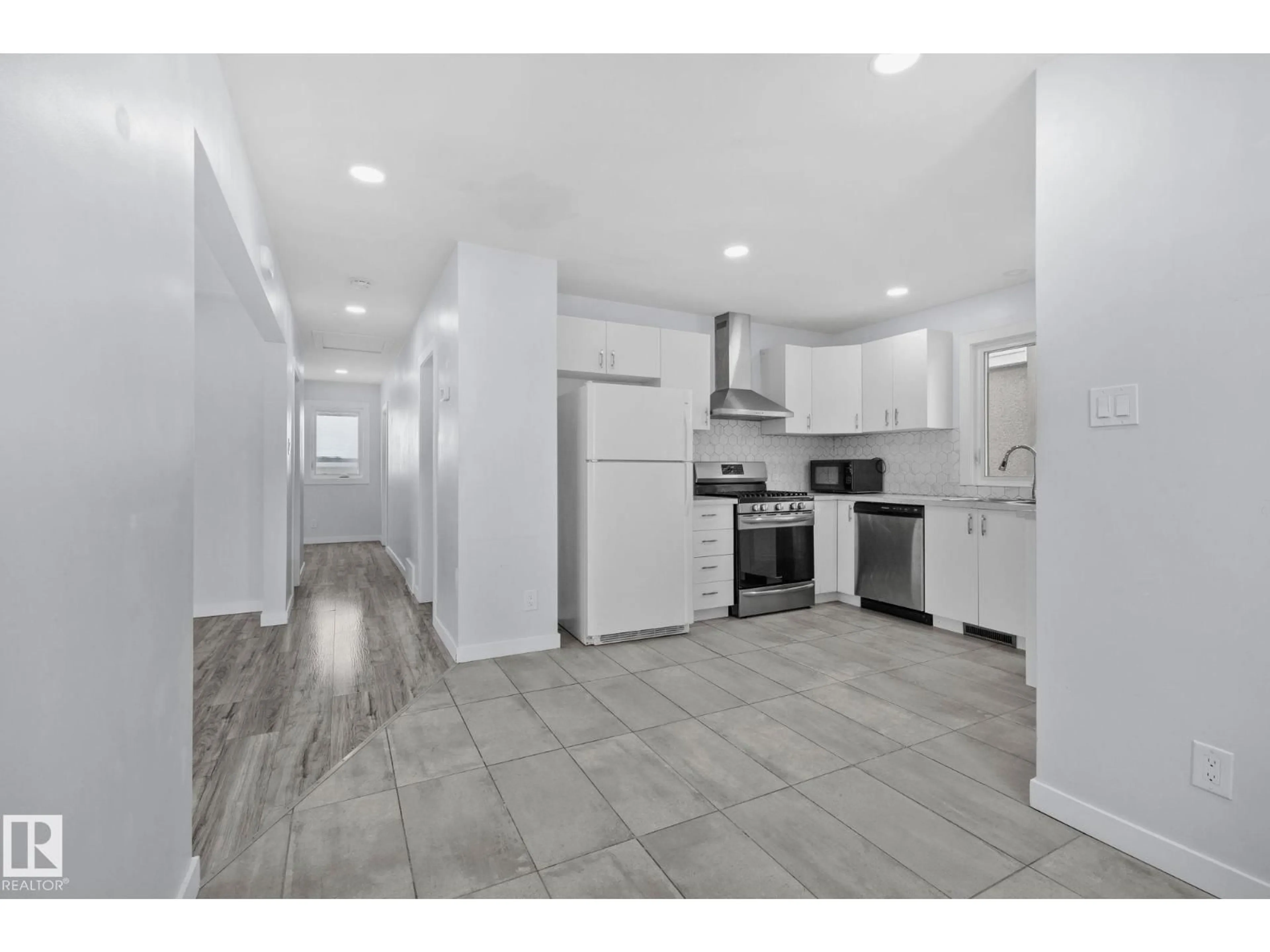 Open concept kitchen, ceramic/tile floor for NW - 12002 37 ST, Edmonton Alberta T5W2C3