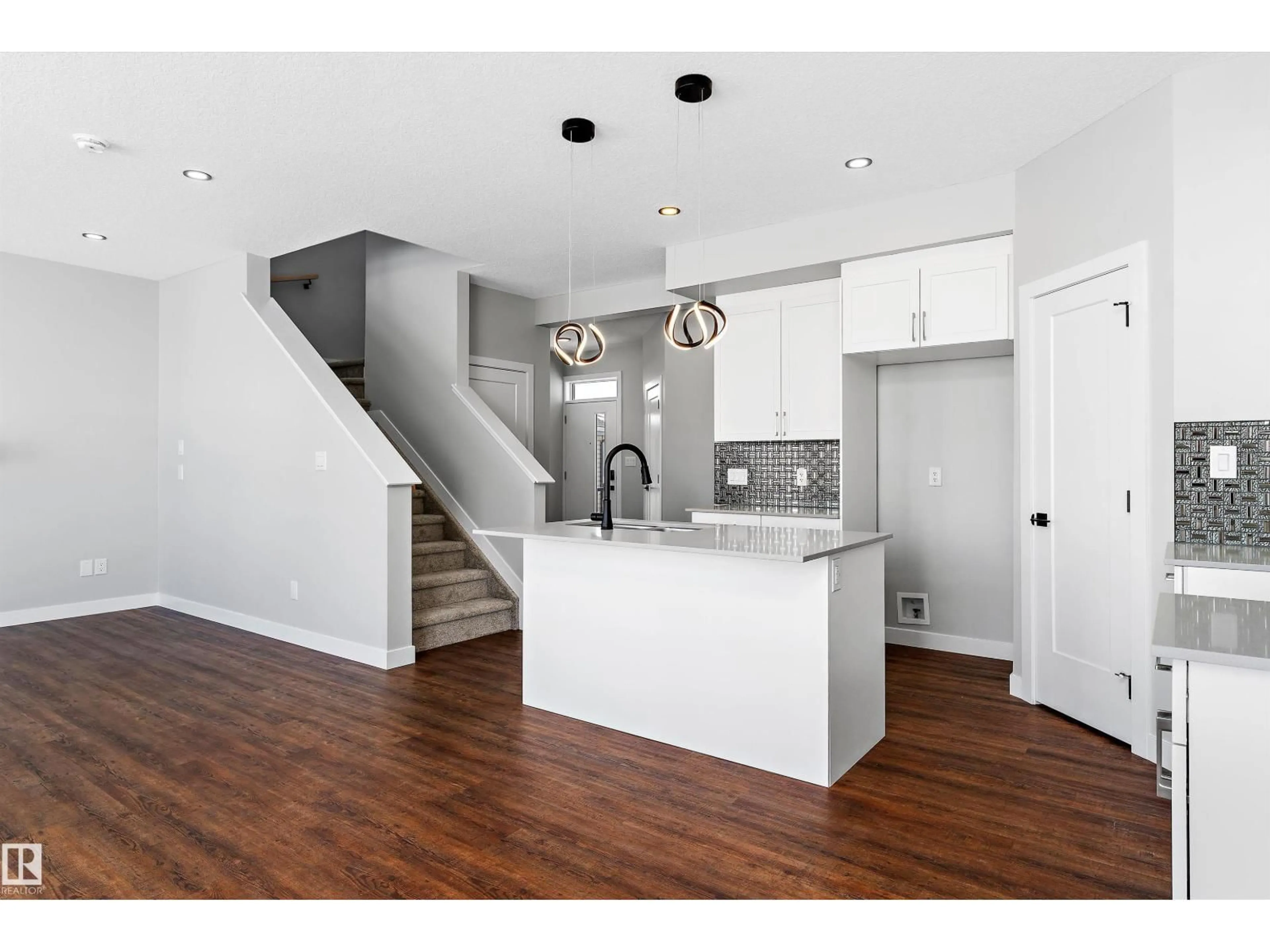 Open concept kitchen, wood/laminate floor for 72 MAPLE CR, Gibbons Alberta T0A1N0