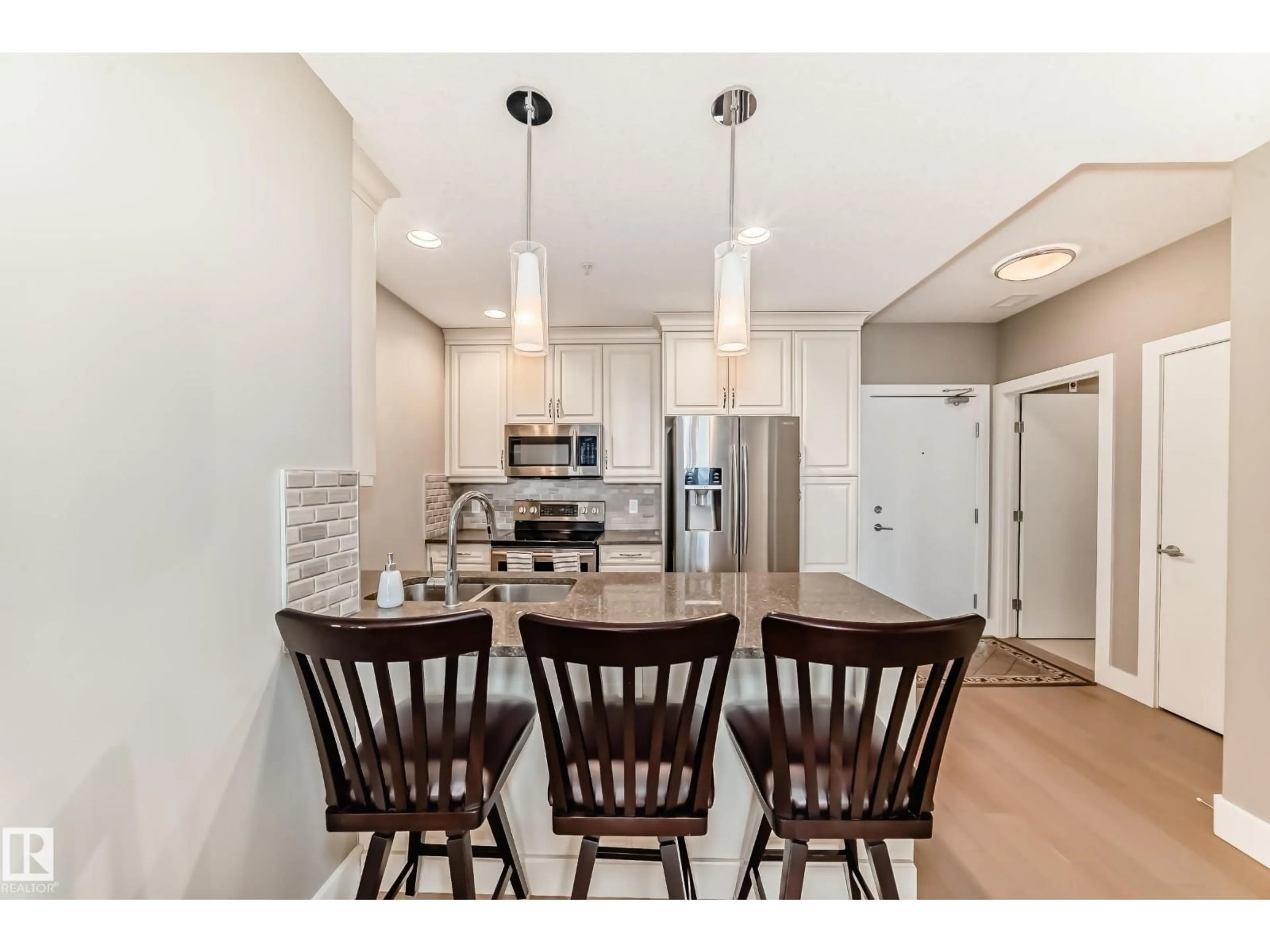 Open concept kitchen, wood/laminate floor for 506 - 11080 ELLERSLIE RD, Edmonton Alberta T6W2C2