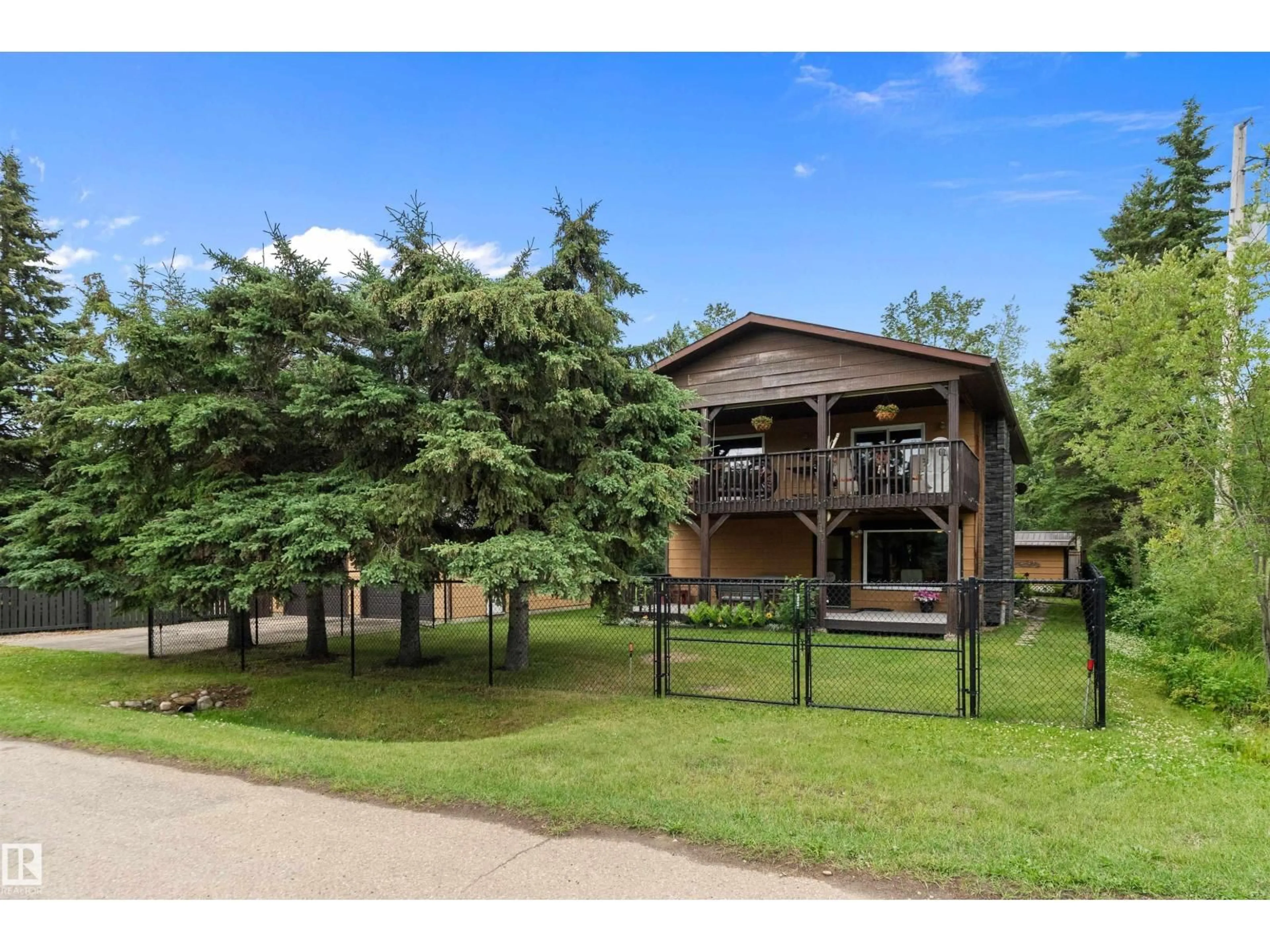 A pic from outside/outdoor area/front of a property/back of a property/a pic from drone, water/lake/river/ocean view for 110 1ST AV, Rural Wetaskiwin County Alberta T0C1X0