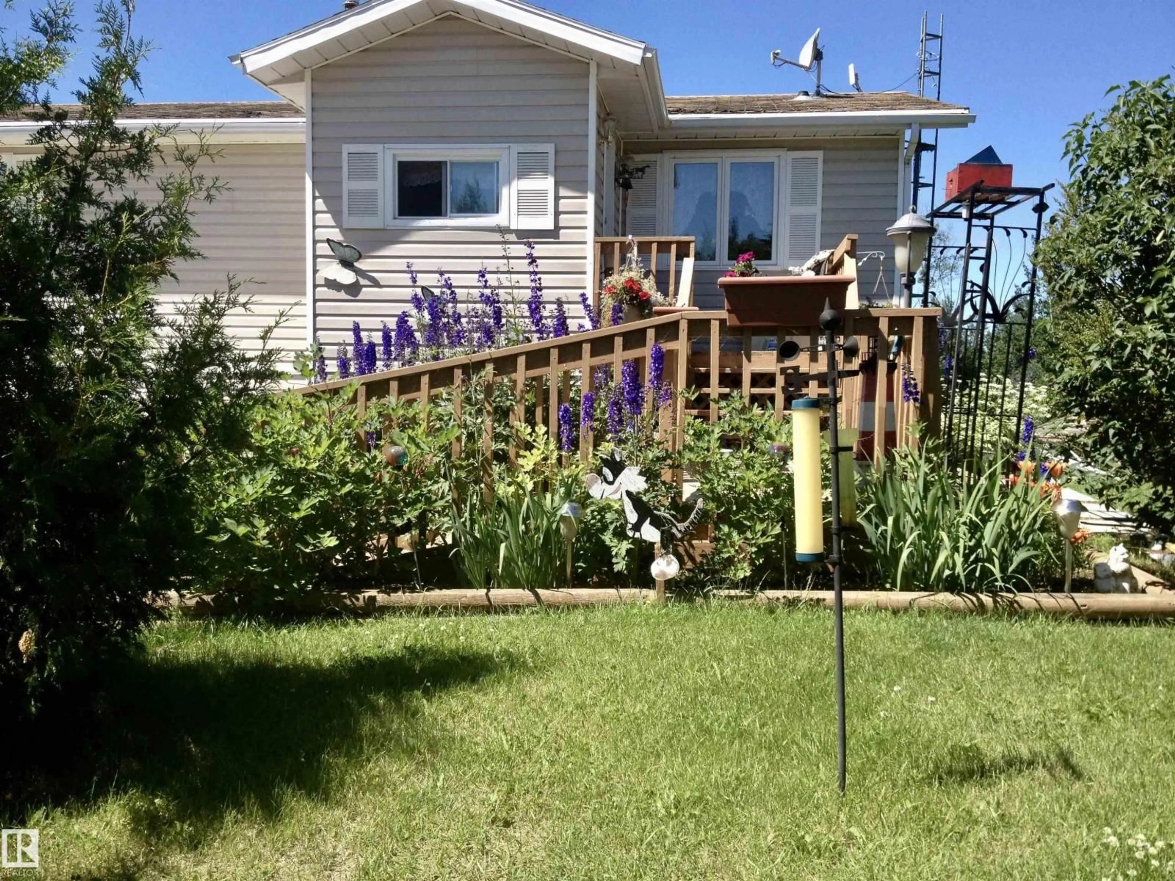 A pic from outside/outdoor area/front of a property/back of a property/a pic from drone, street for 108 - 58532 RR 113, Rural St. Paul County Alberta T0A0C0