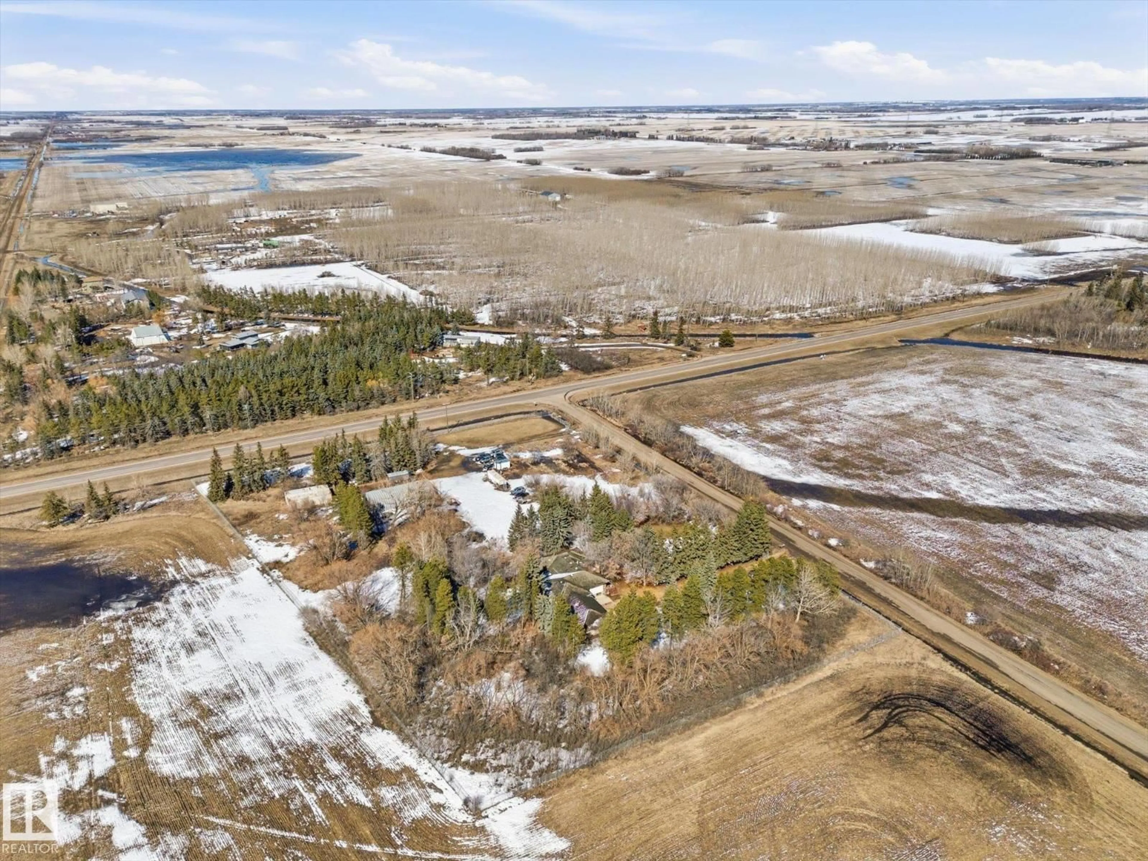 A pic from outside/outdoor area/front of a property/back of a property/a pic from drone, water/lake/river/ocean view for 25750 18 ST, Edmonton Alberta T5Y6B5