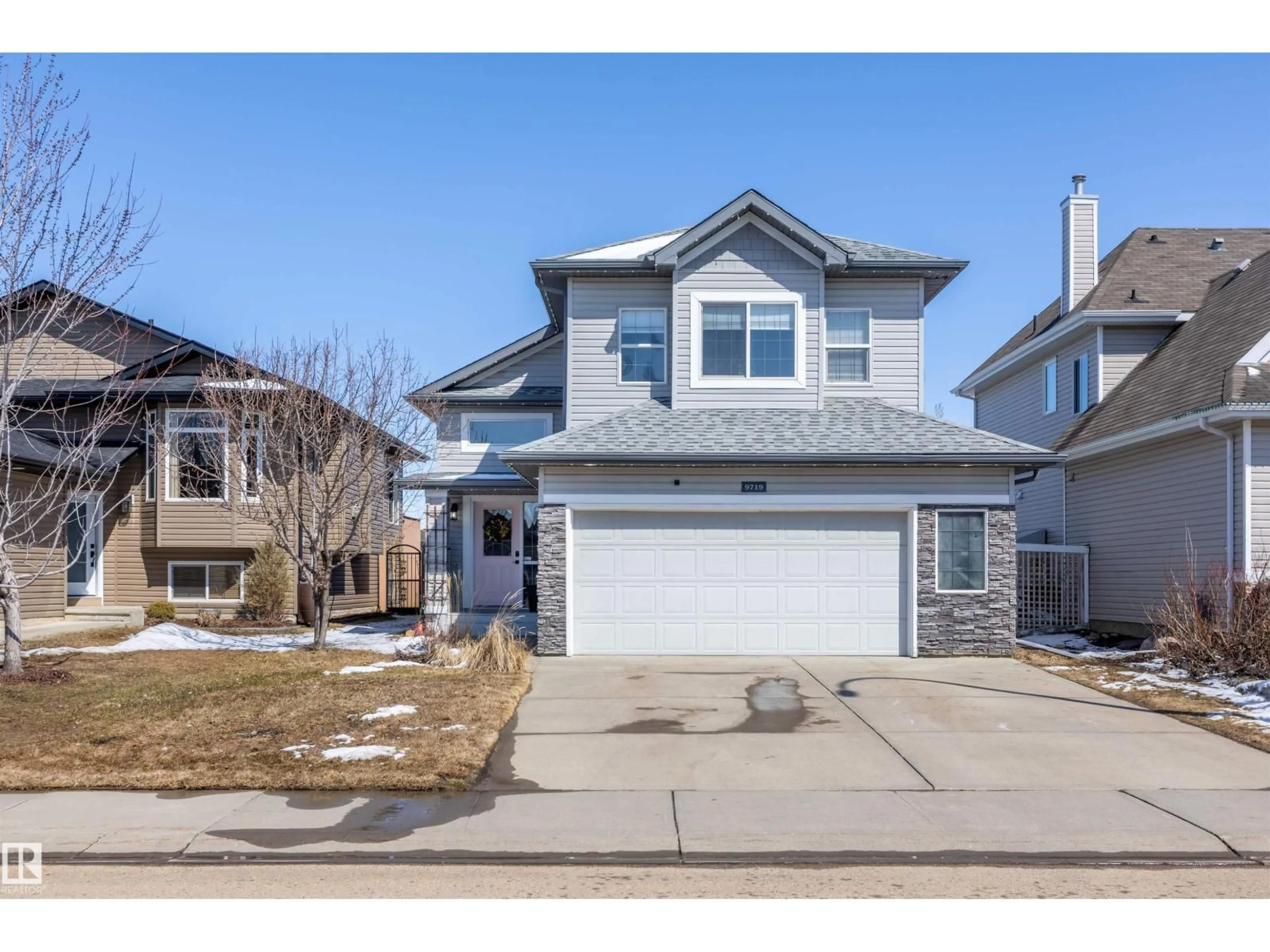 Home with vinyl exterior material, street for 9719 87 ST, Morinville Alberta T8R1V2