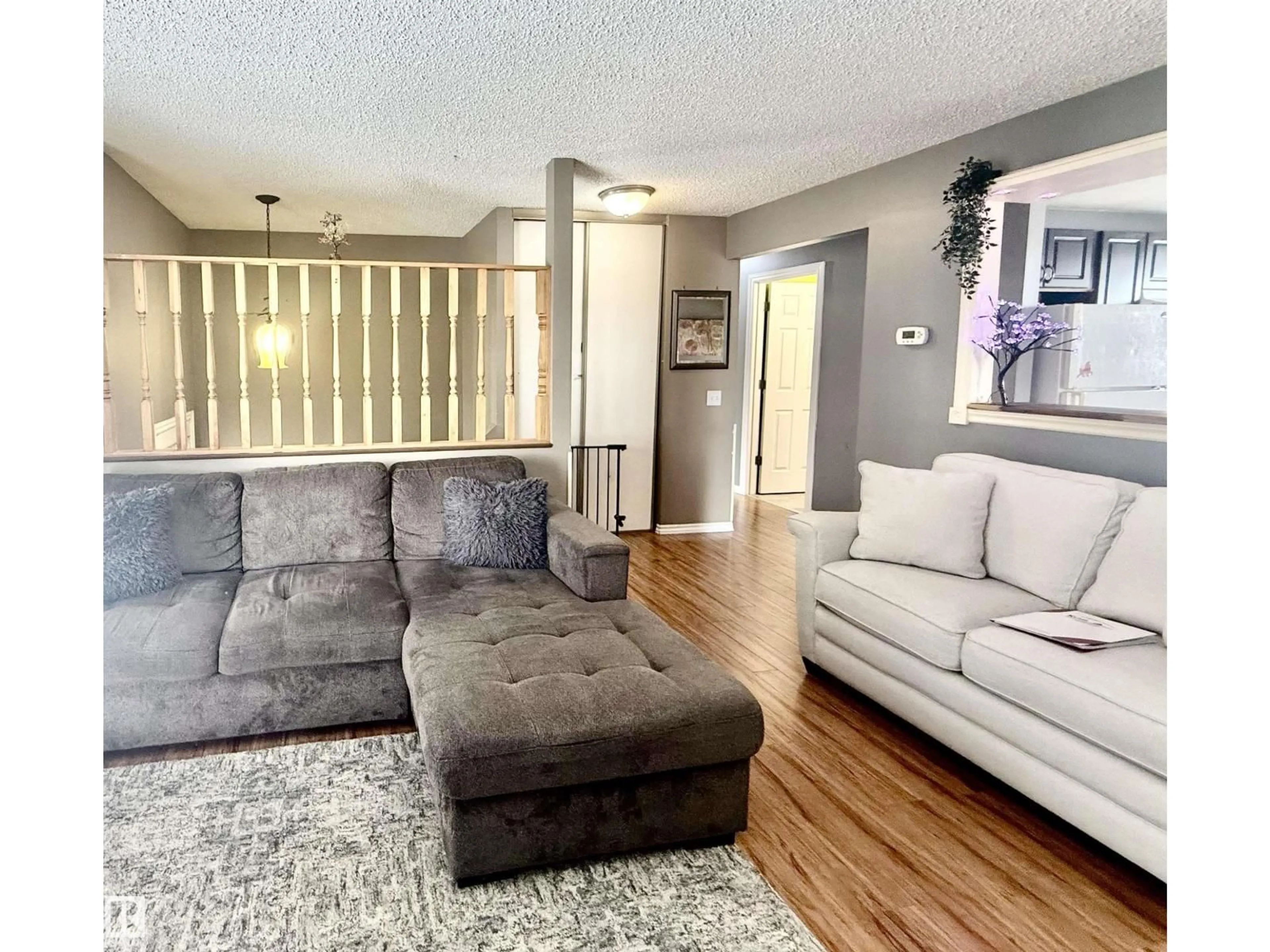 Living room with furniture, unknown for NW - 3520 17B AV, Edmonton Alberta T6L2P3