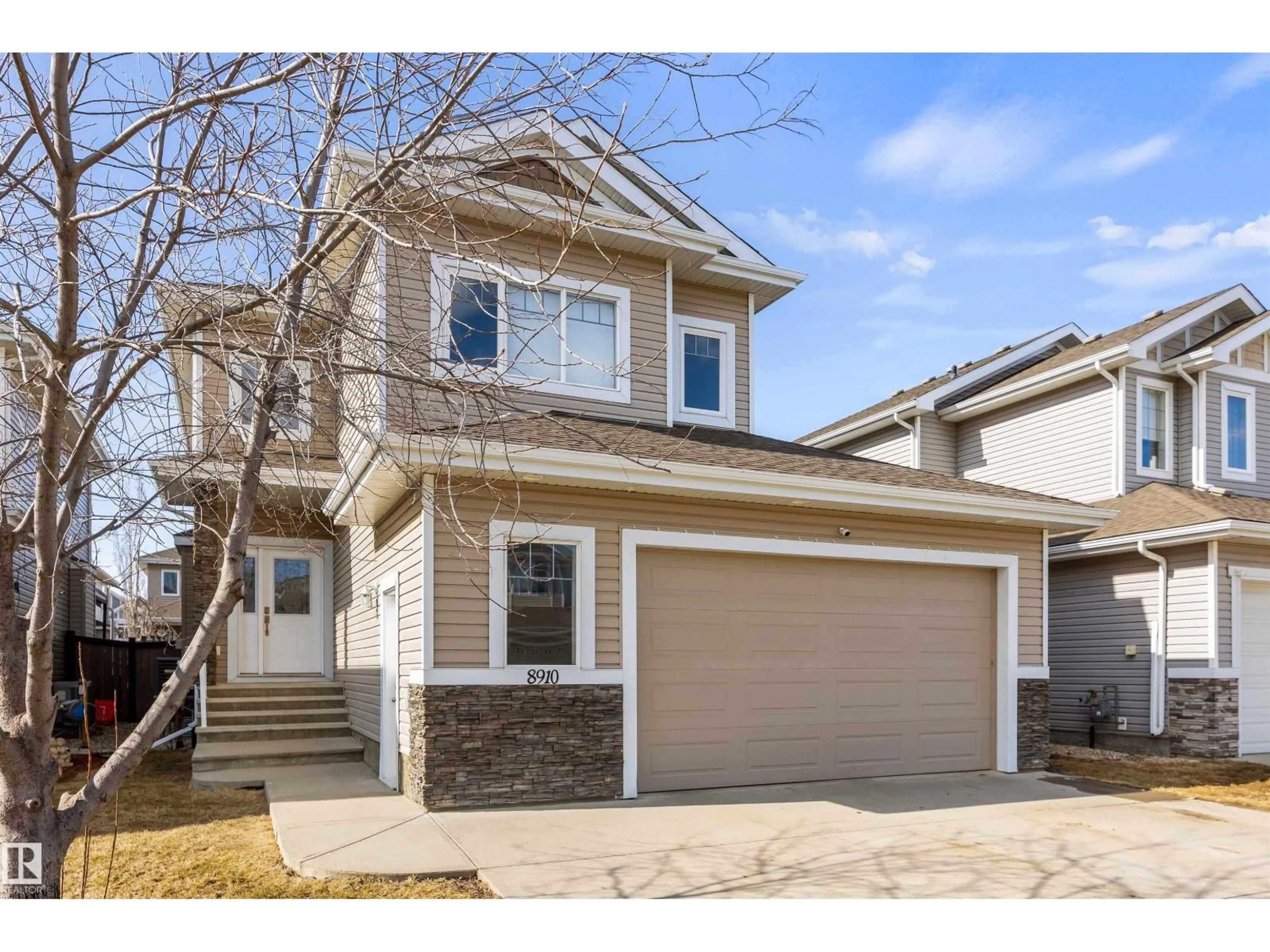 Home with vinyl exterior material, street for 8910 97 AV, Morinville Alberta T8R2N7