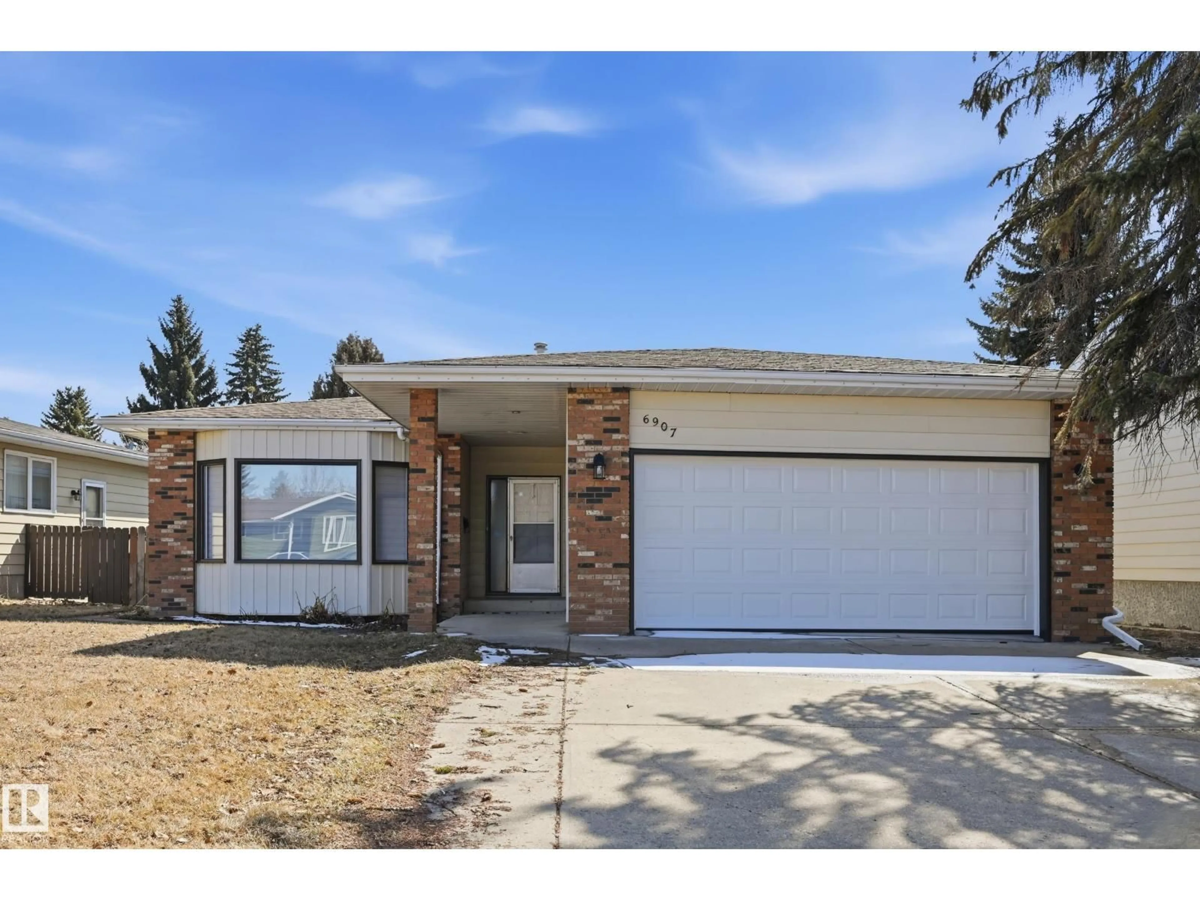 Home with brick exterior material, street for 6907 19 AV, Edmonton Alberta T6K2G7