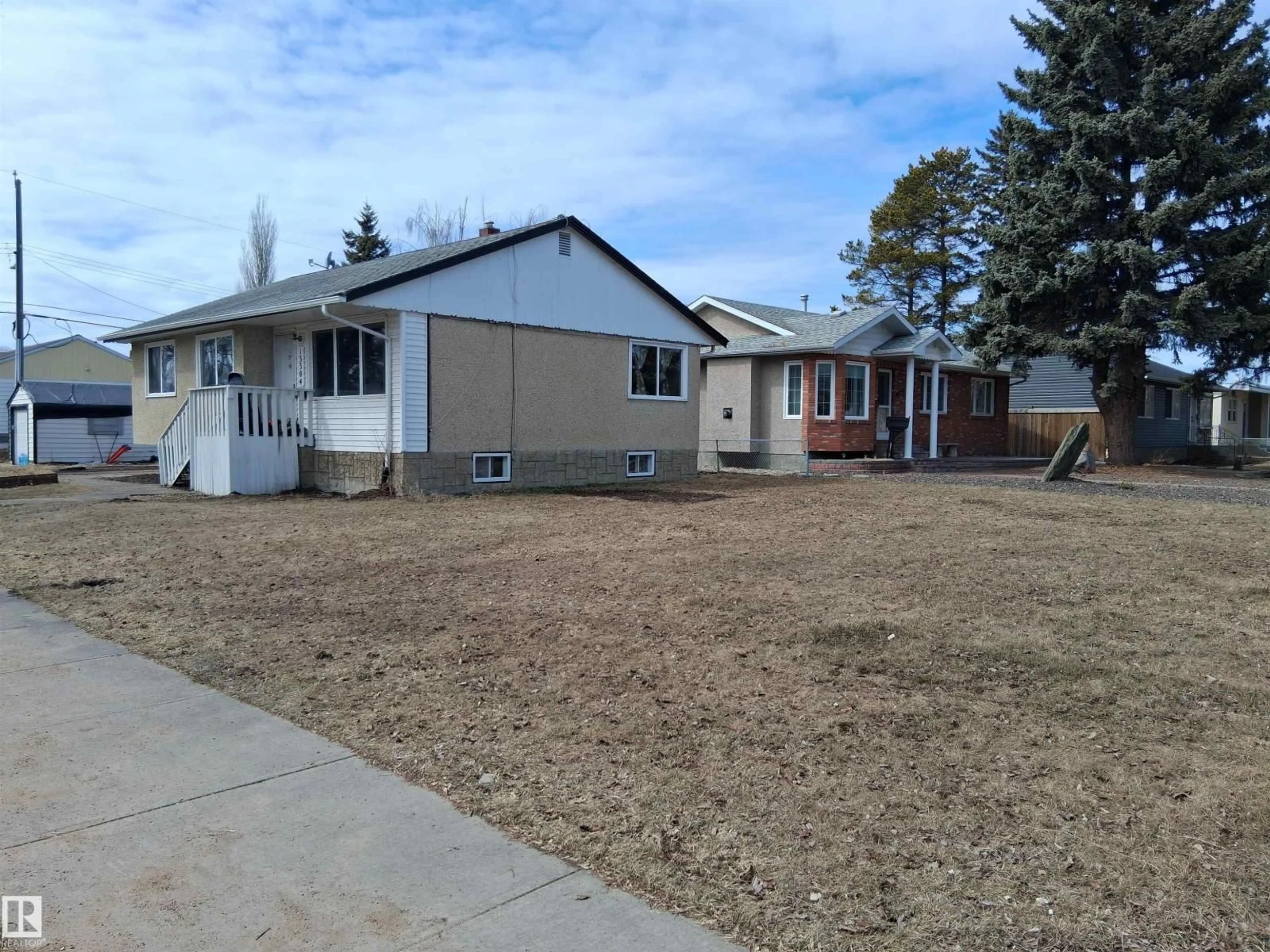 Home with vinyl exterior material, street for NW - 13304 122 AV, Edmonton Alberta T5L2V5