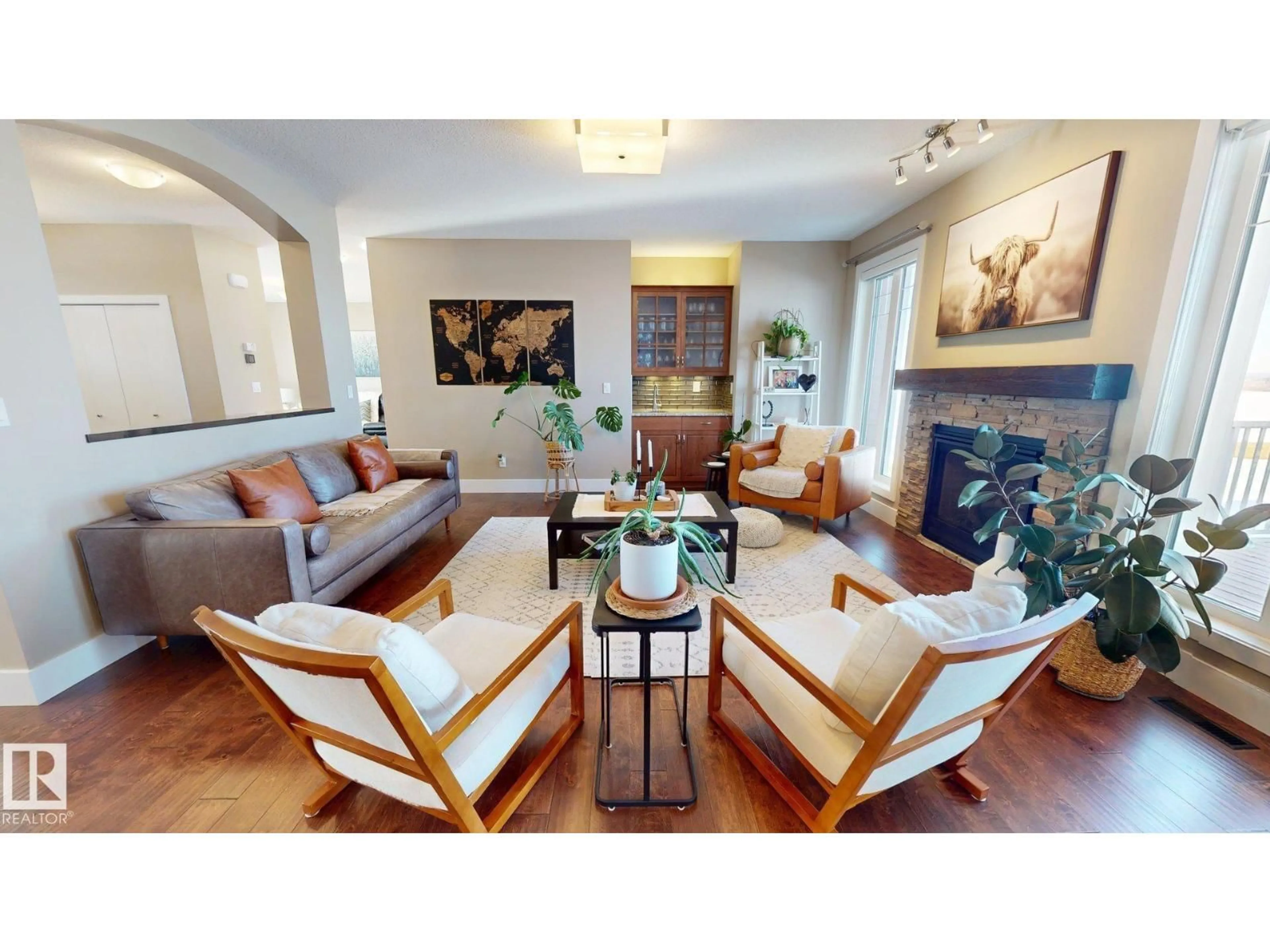 Living room with furniture, wood/laminate floor for 55302 RGE ROAD 262, Rural Sturgeon County Alberta T8R0W6