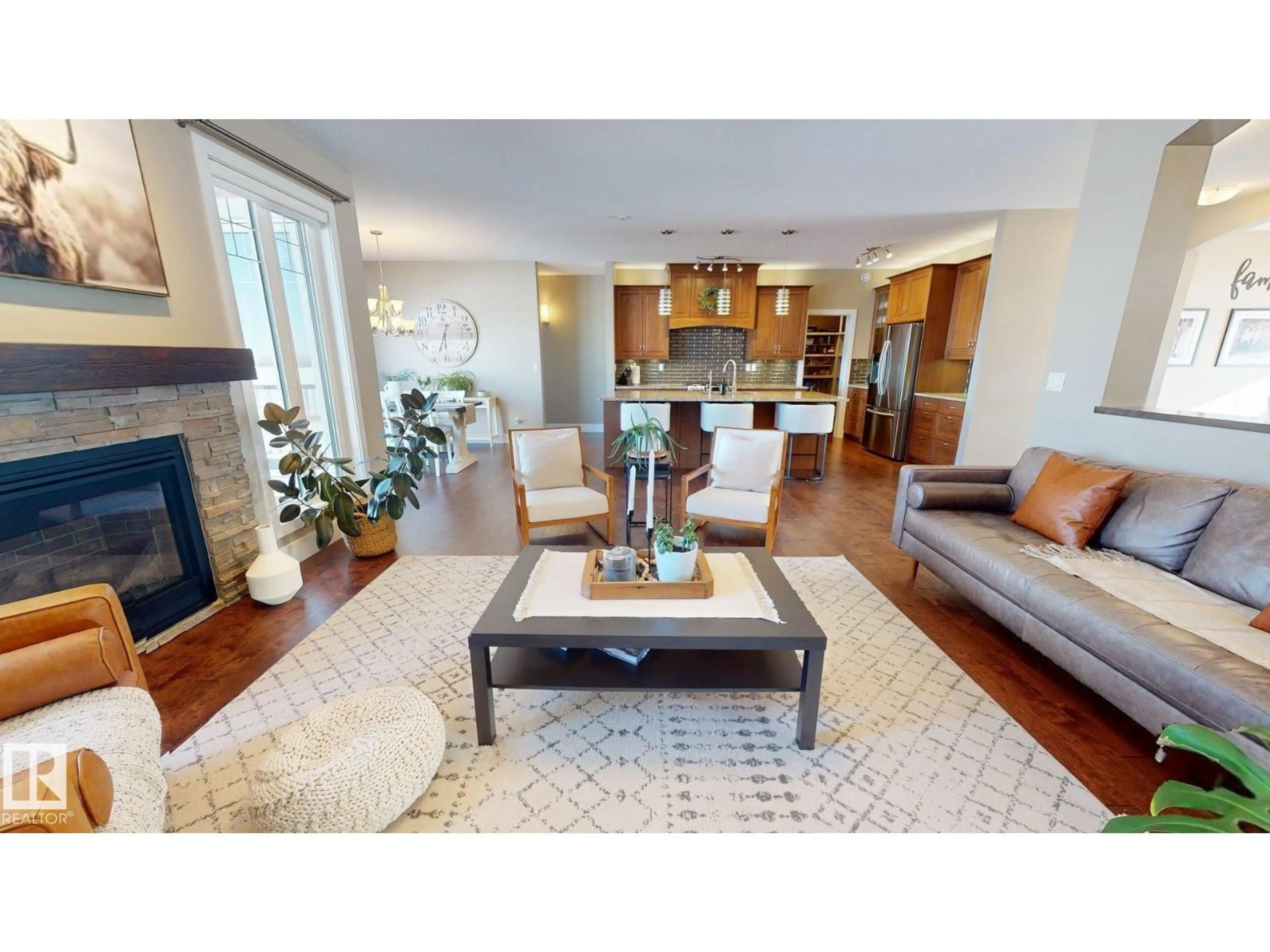 Living room with furniture, wood/laminate floor for 55302 RGE ROAD 262, Rural Sturgeon County Alberta T8R0W6