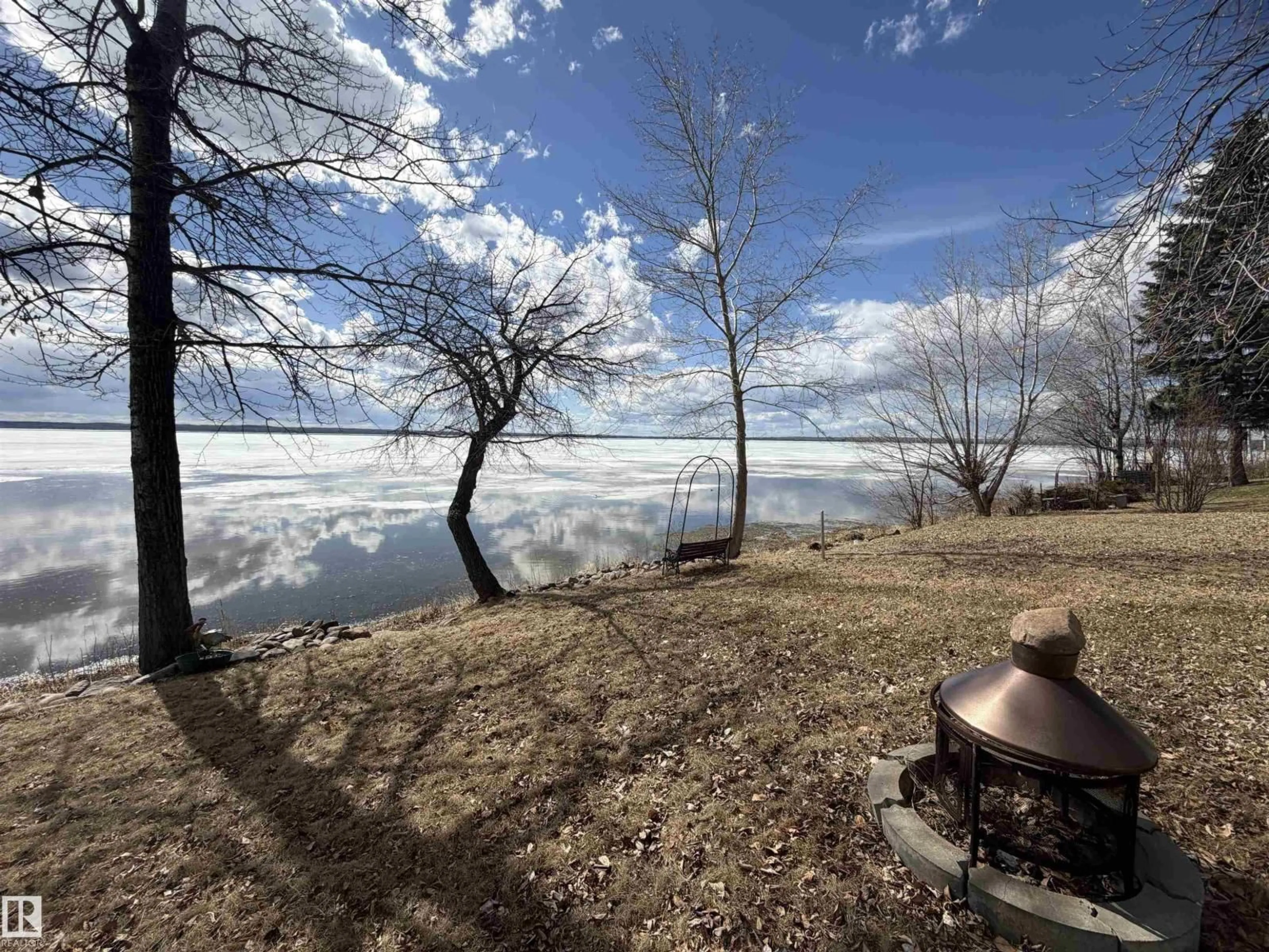 A pic from outside/outdoor area/front of a property/back of a property/a pic from drone, water/lake/river/ocean view for Johnsonia BE - A19 BEACH AVE, Rural Leduc County Alberta T0C2P0