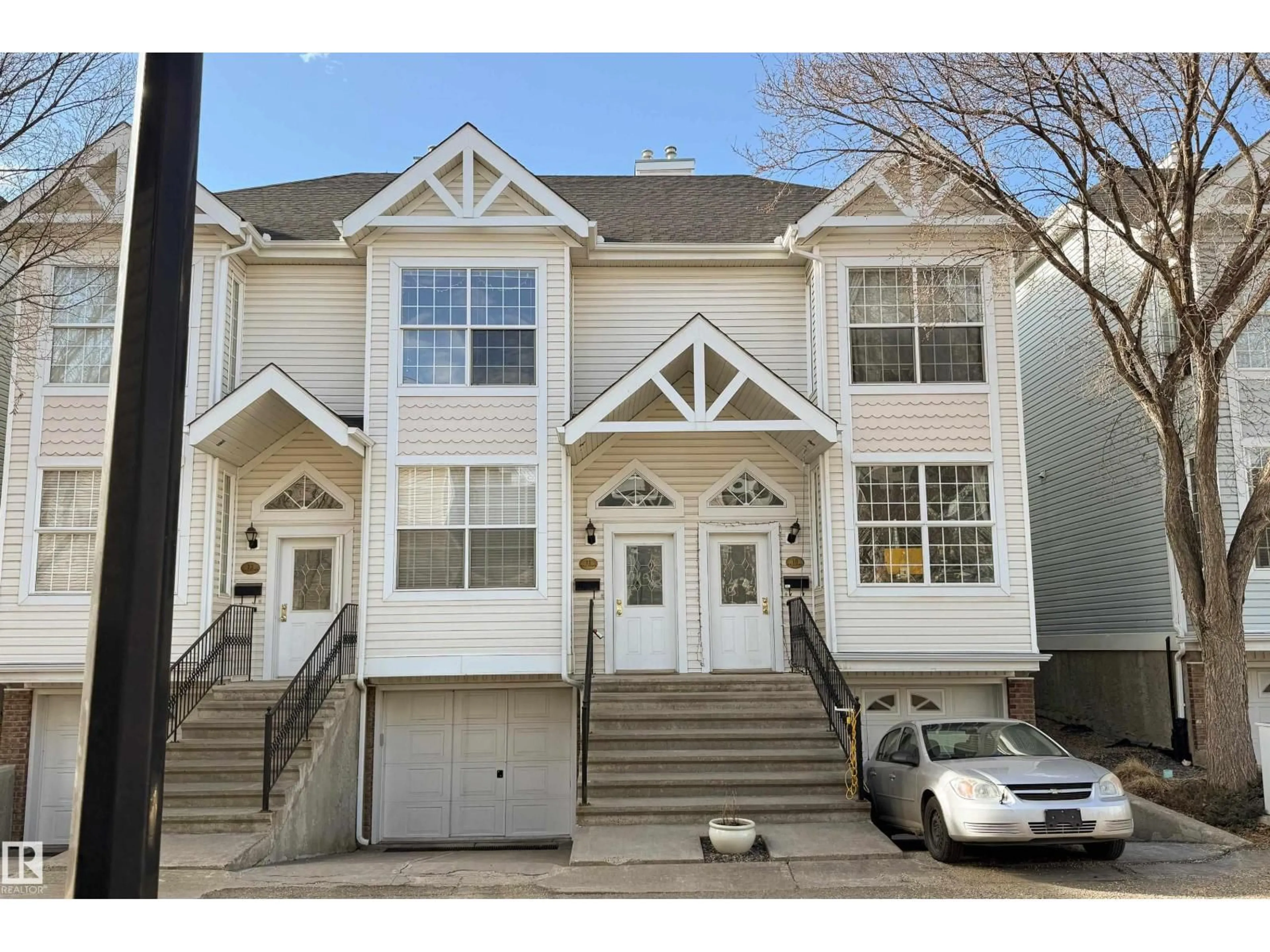 Home with vinyl exterior material, street for #11 - 10235 111 ST, Edmonton Alberta T5K2V5