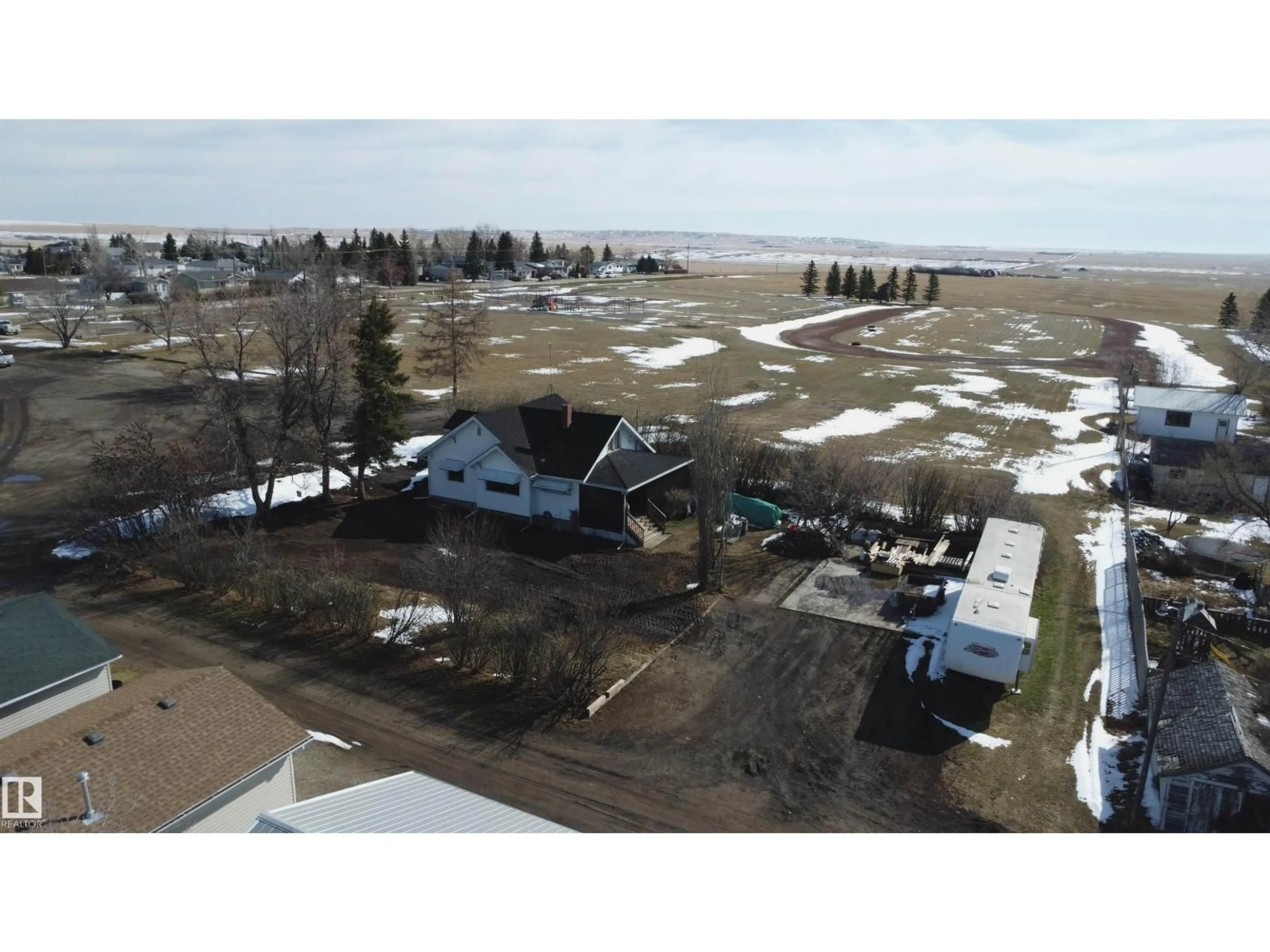 A pic from outside/outdoor area/front of a property/back of a property/a pic from drone, water/lake/river/ocean view for E - 213 8 AV, Standard Alberta T0J3G0