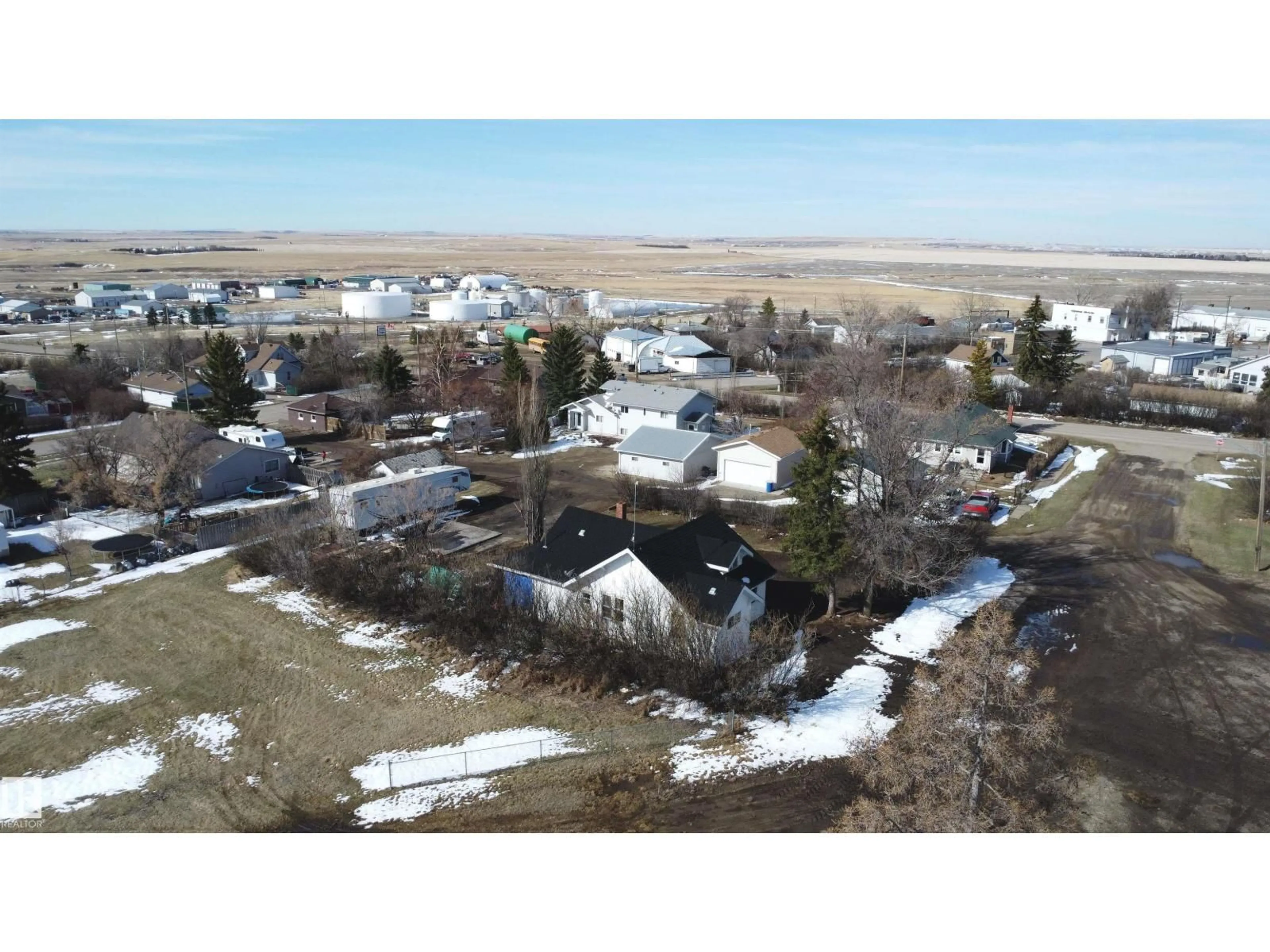 A pic from outside/outdoor area/front of a property/back of a property/a pic from drone, water/lake/river/ocean view for E - 213 8 AV, Standard Alberta T0J3G0