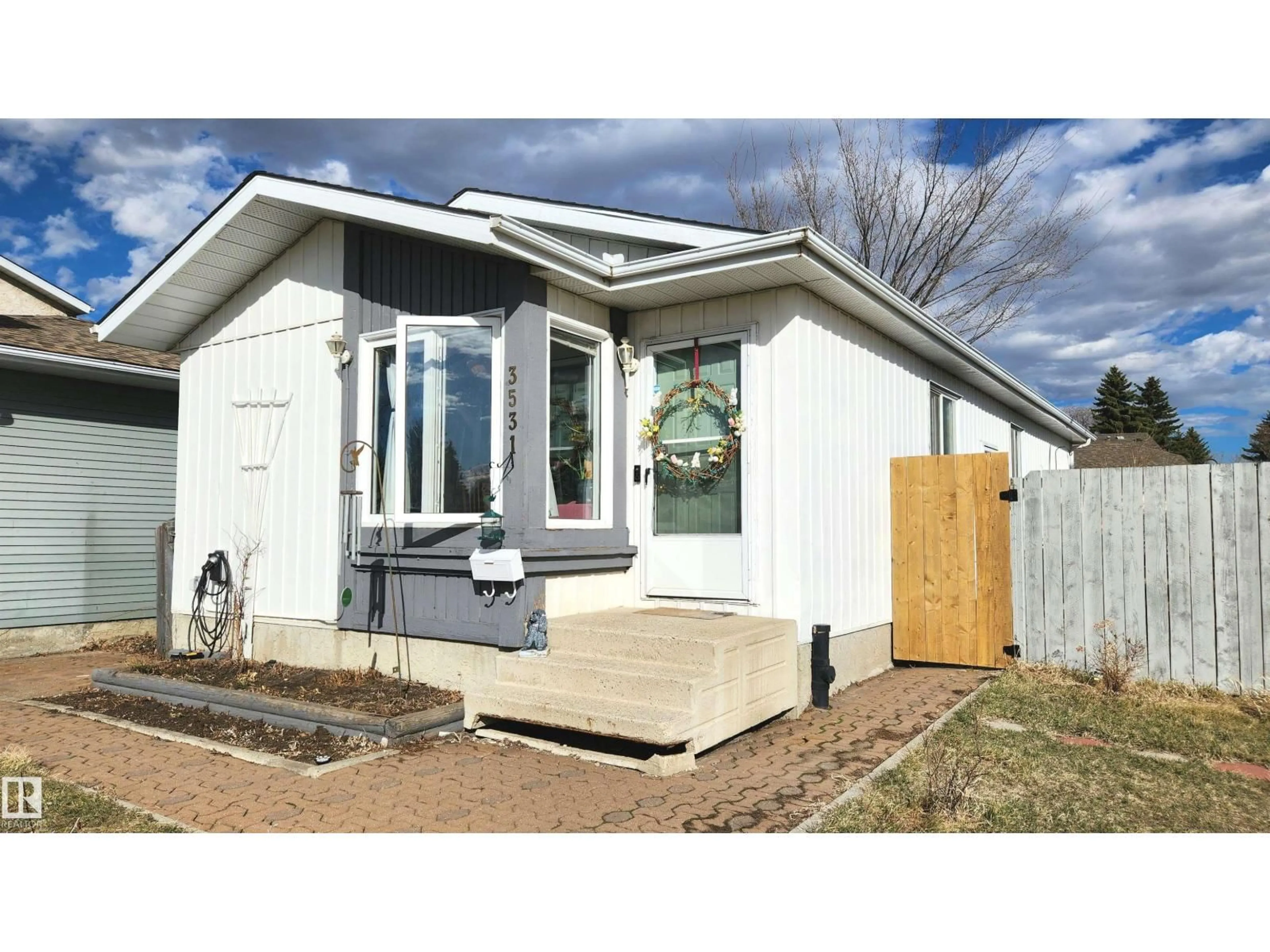 Home with vinyl exterior material, street for 3531 46 ST, Edmonton Alberta T6L5C6