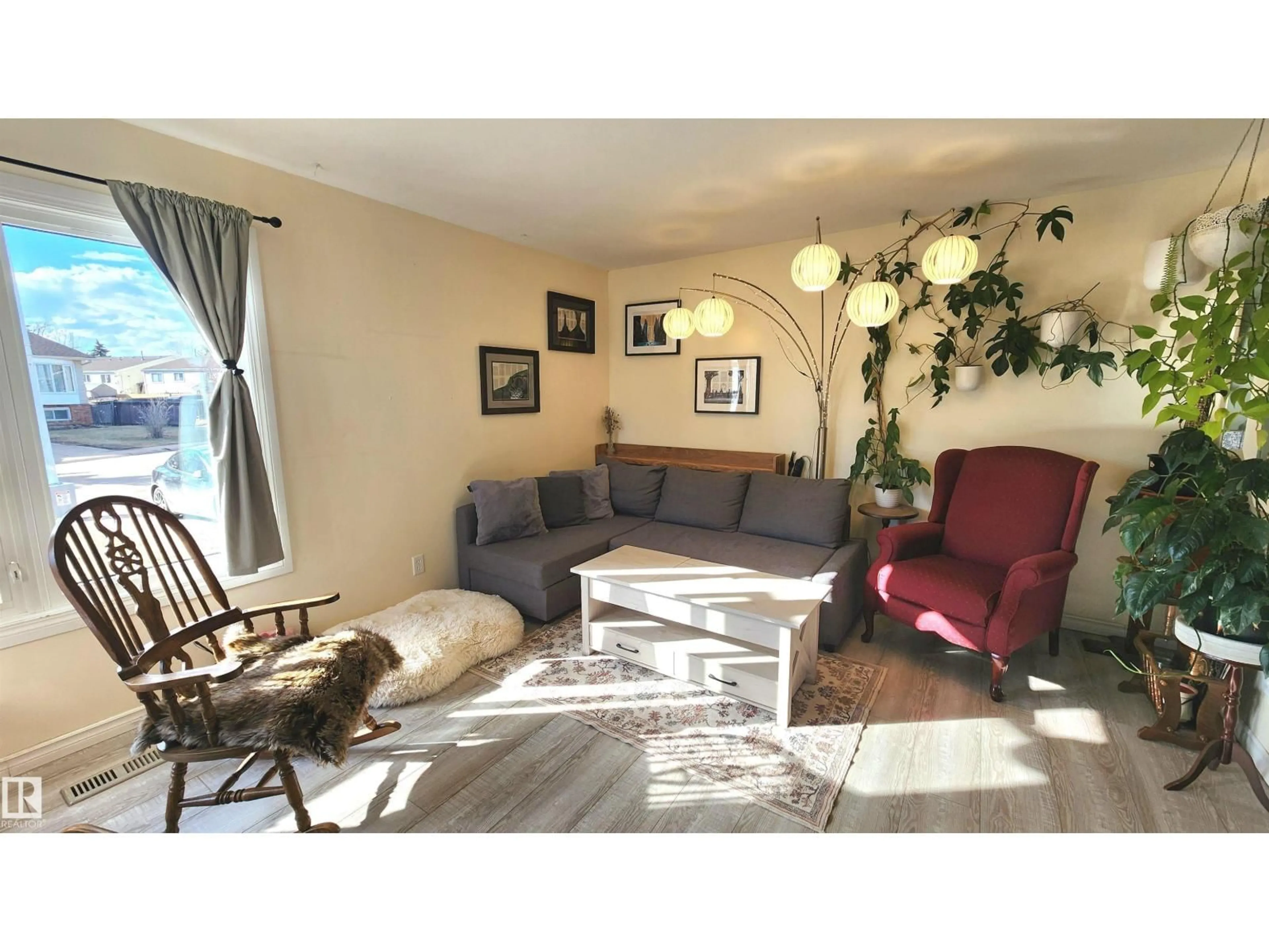 Living room with furniture, wood/laminate floor for 3531 46 ST, Edmonton Alberta T6L5C6