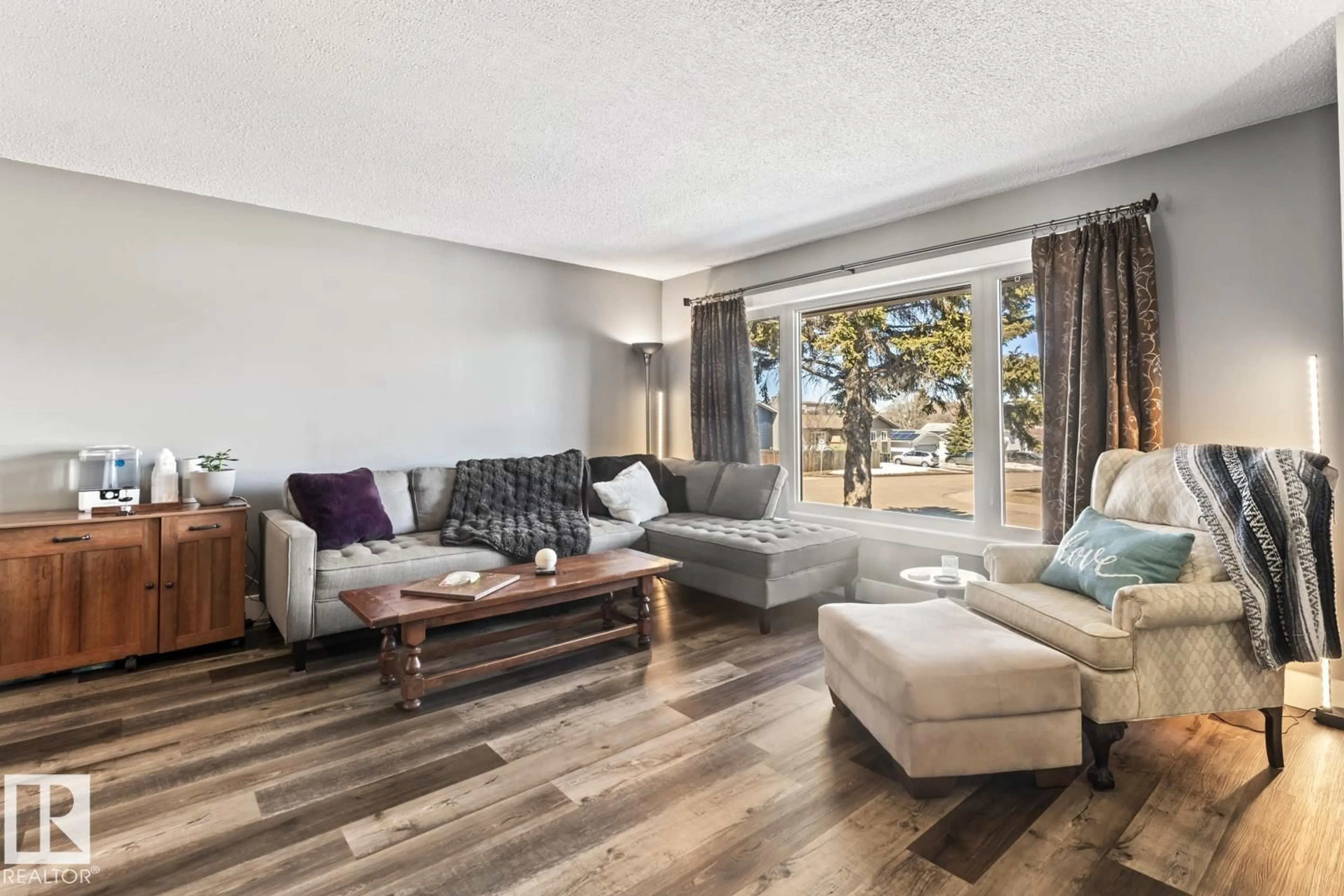 Living room with furniture, wood/laminate floor for 1009 15 AV, Cold Lake Alberta T9M1J5