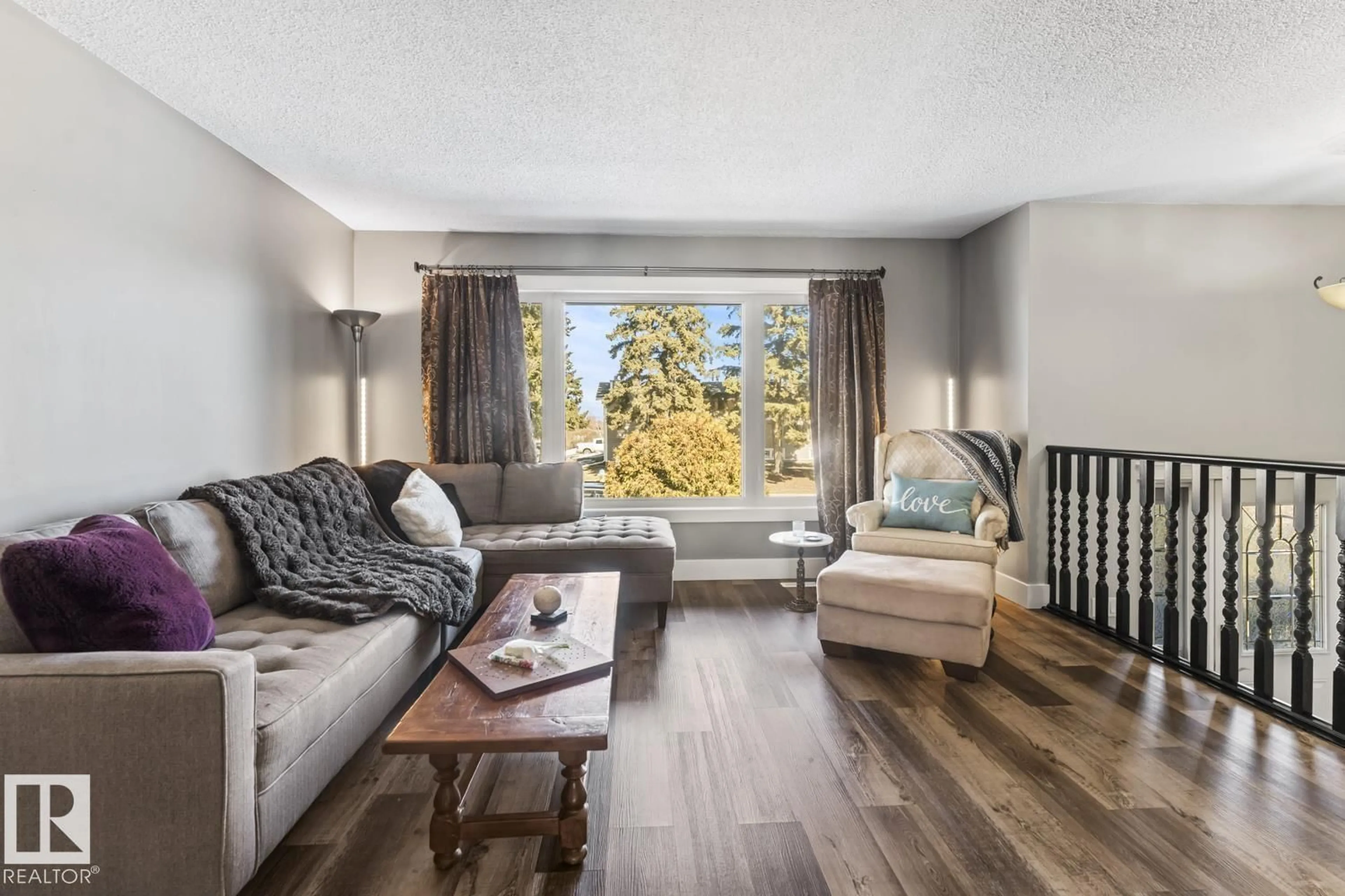 Living room with furniture, wood/laminate floor for 1009 15 AV, Cold Lake Alberta T9M1J5