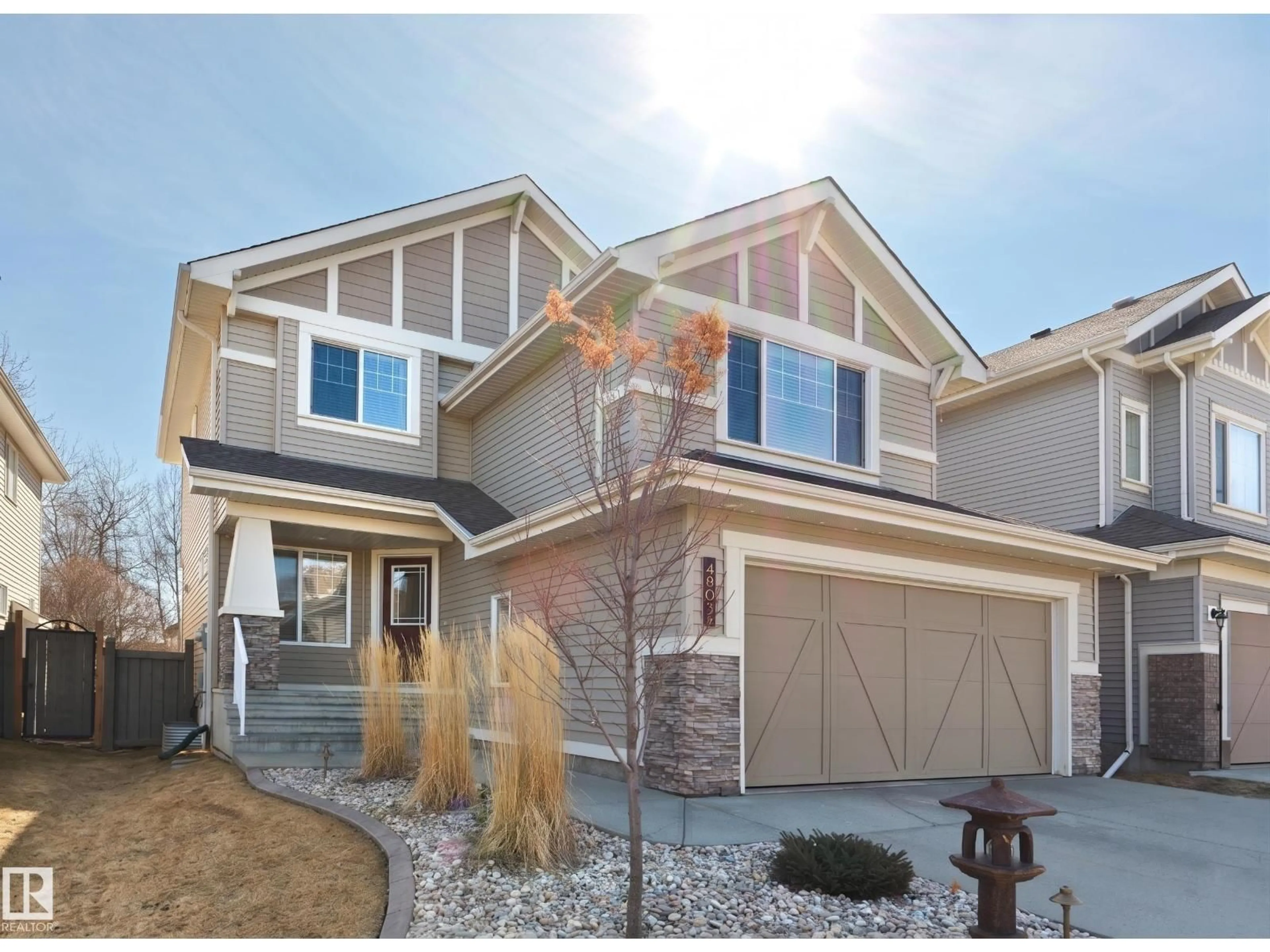 Home with vinyl exterior material, street for 4903 213 ST, Edmonton Alberta T6M0G6