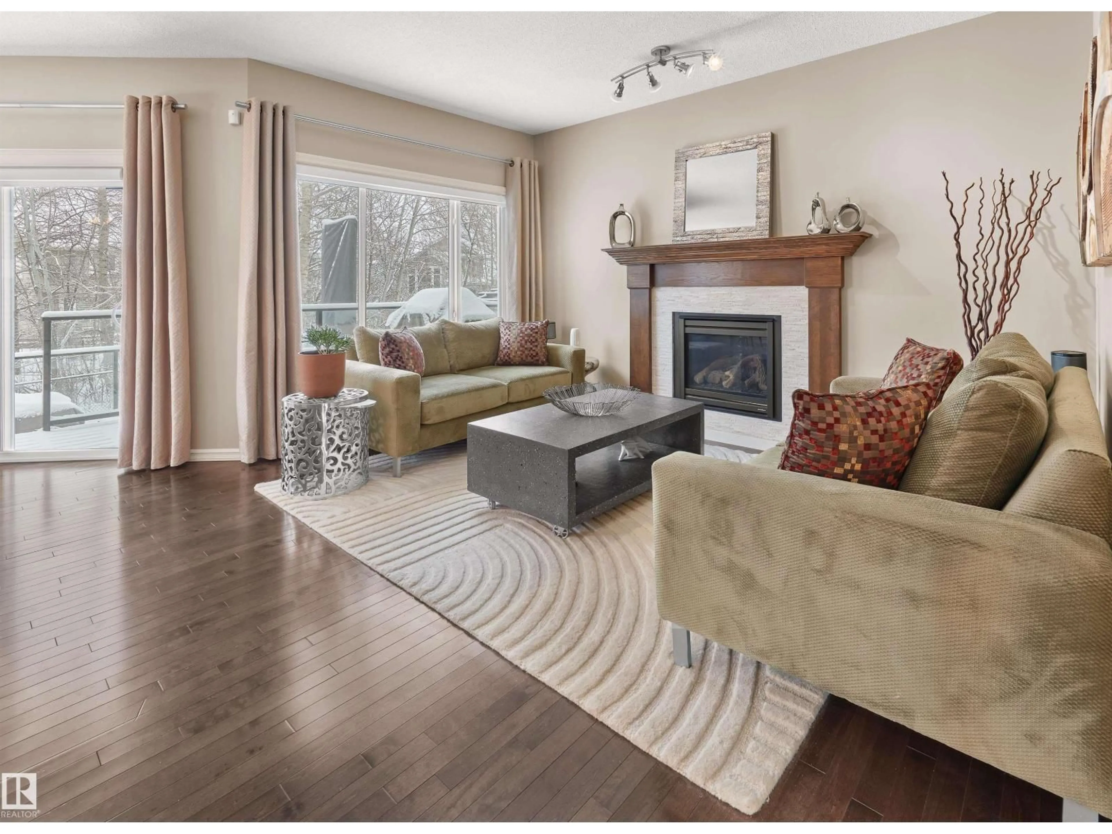 Living room with furniture, wood/laminate floor for 4903 213 ST, Edmonton Alberta T6M0G6