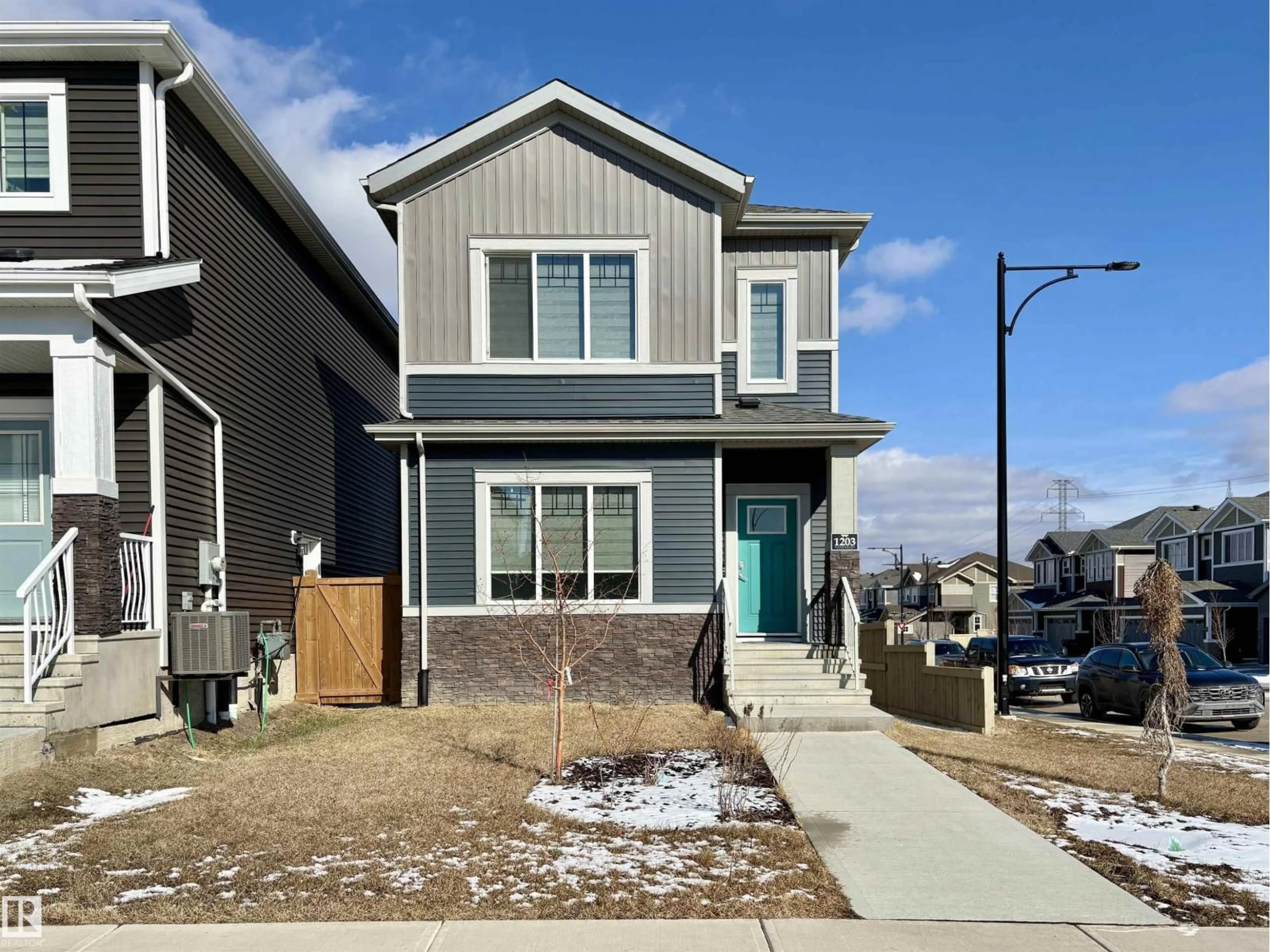 Home with vinyl exterior material, street for 1203 EATON LN, Edmonton Alberta T6M1M9