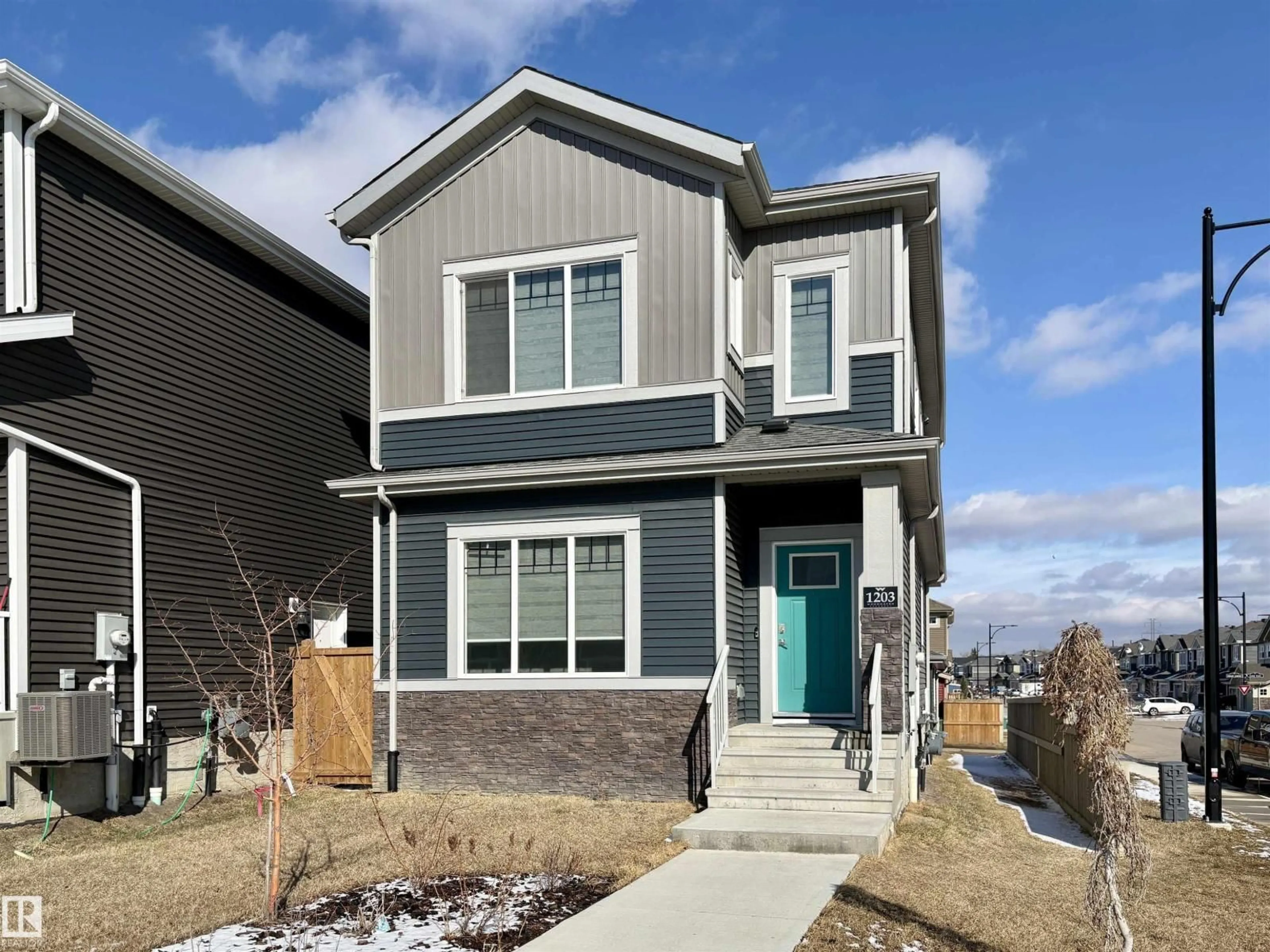 Home with vinyl exterior material, street for 1203 EATON LN, Edmonton Alberta T6M1M9