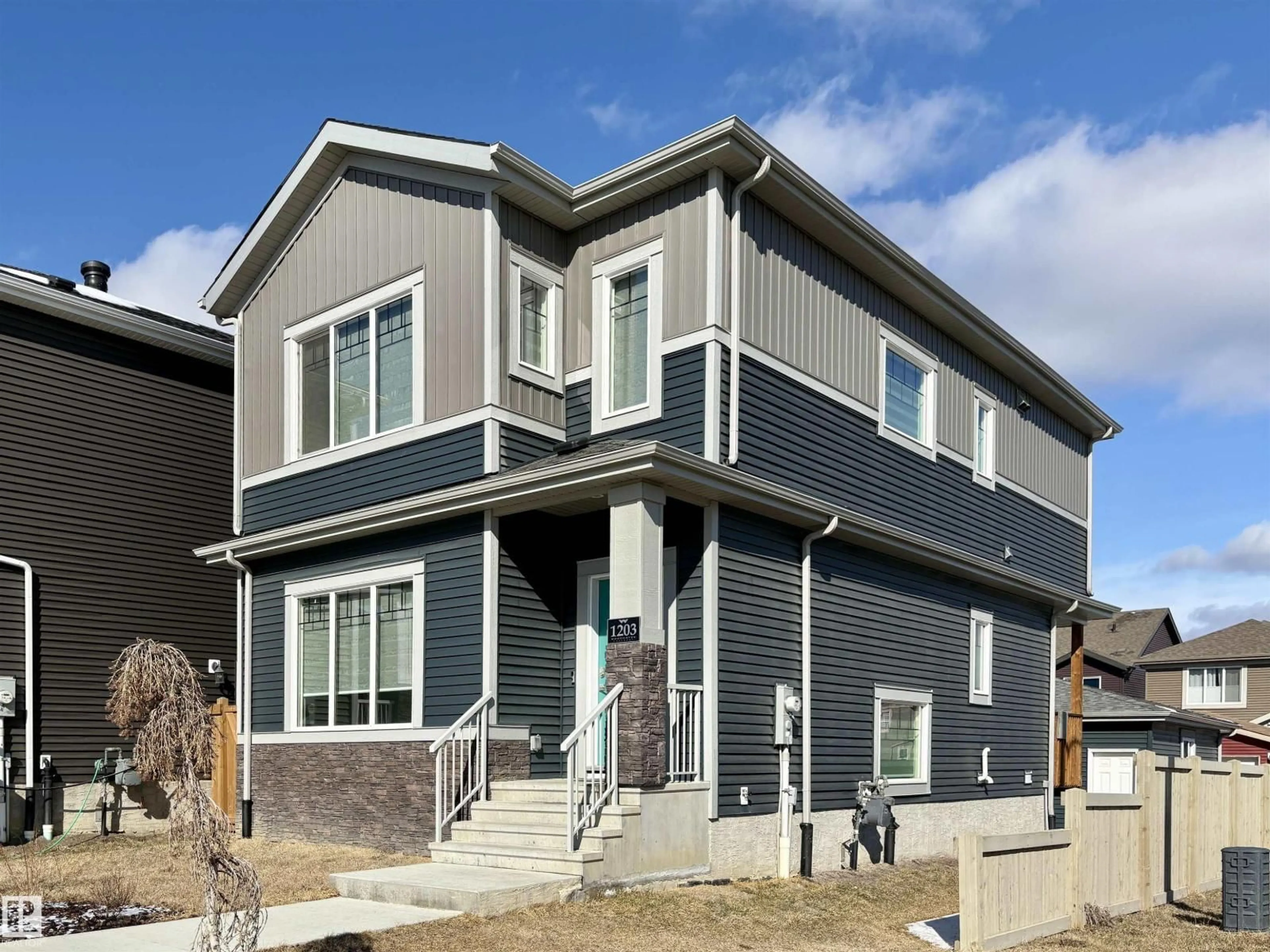 Home with vinyl exterior material, street for 1203 EATON LN, Edmonton Alberta T6M1M9