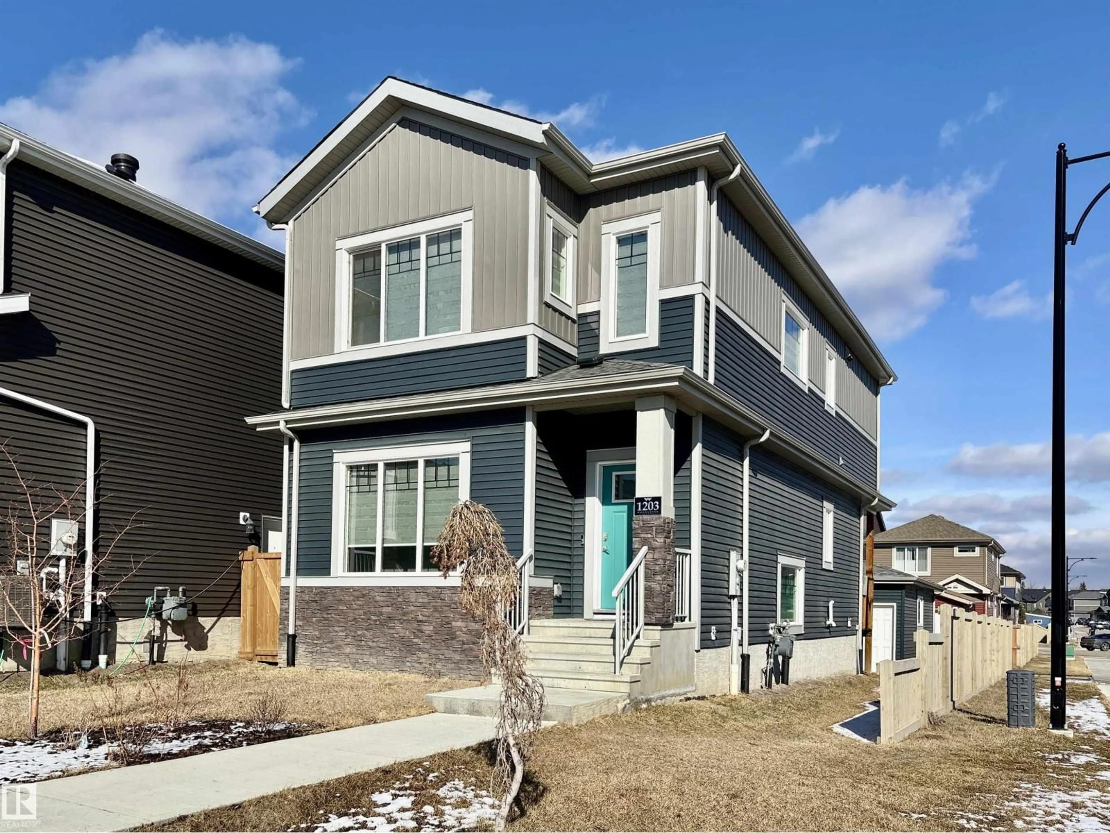 Home with vinyl exterior material, street for 1203 EATON LN, Edmonton Alberta T6M1M9