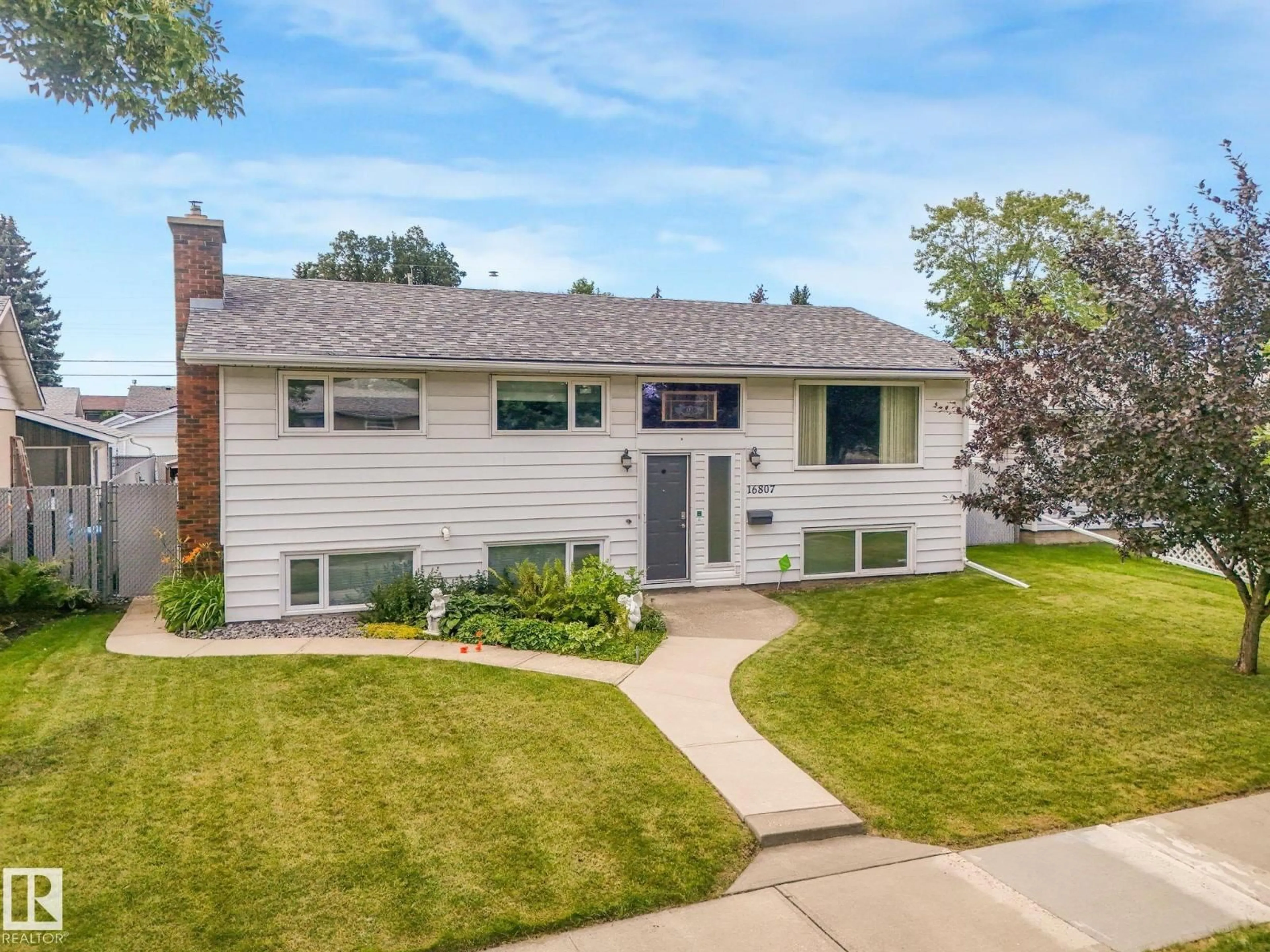 Home with vinyl exterior material, street for 16807 80 AV, Edmonton Alberta T5R3N1