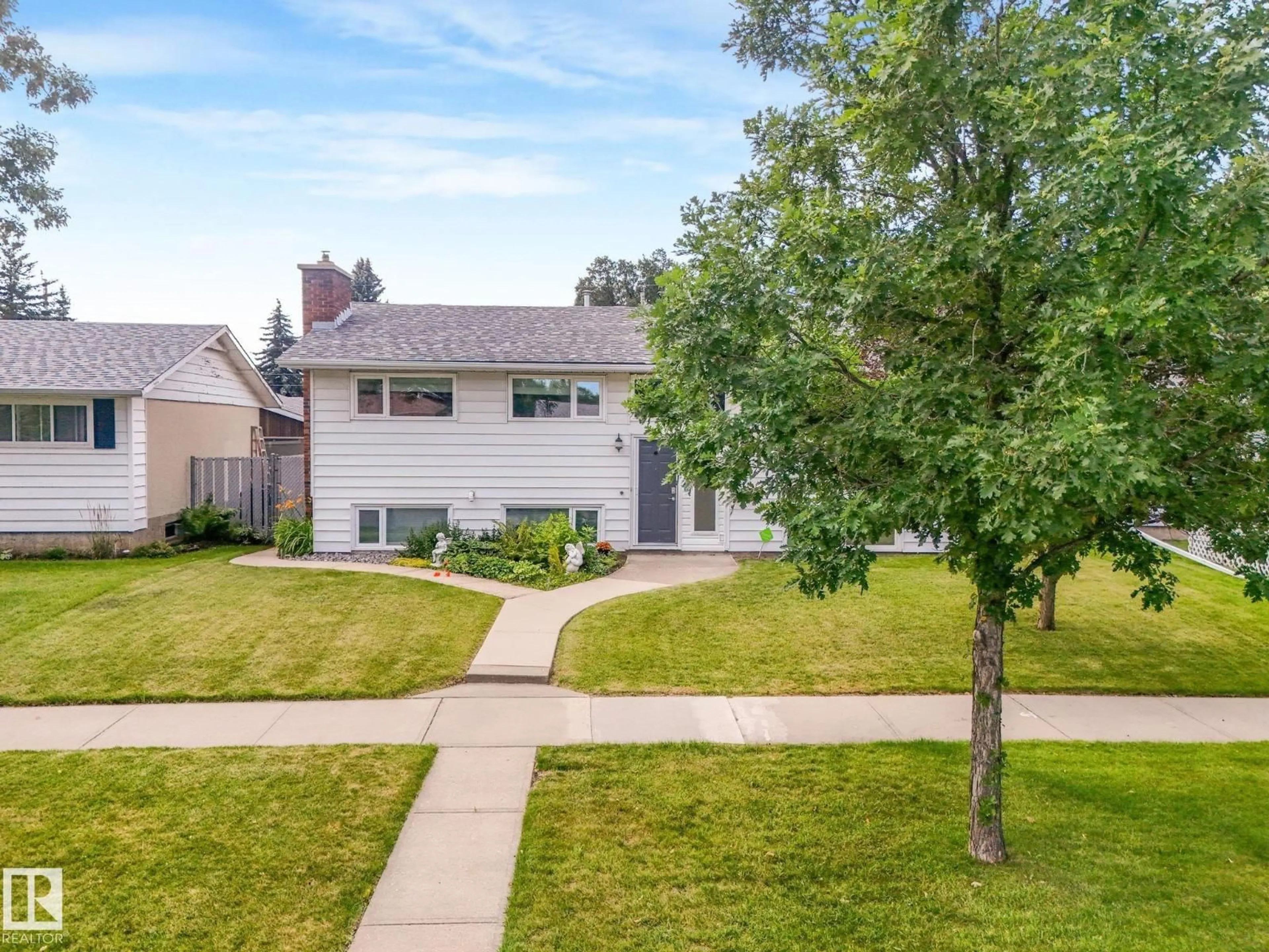 A pic from outside/outdoor area/front of a property/back of a property/a pic from drone, street for 16807 80 AV, Edmonton Alberta T5R3N1