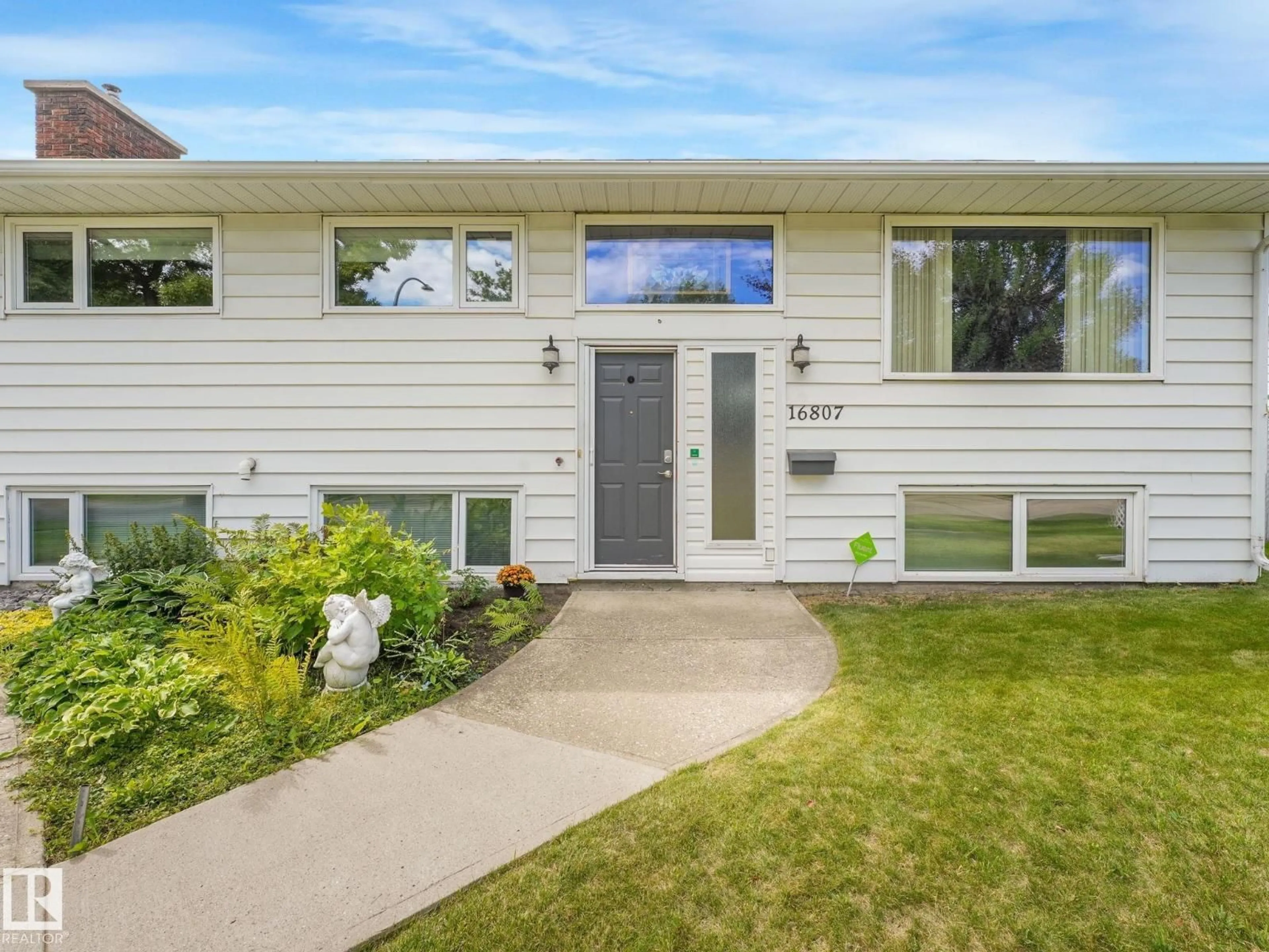 Home with vinyl exterior material, street for 16807 80 AV, Edmonton Alberta T5R3N1