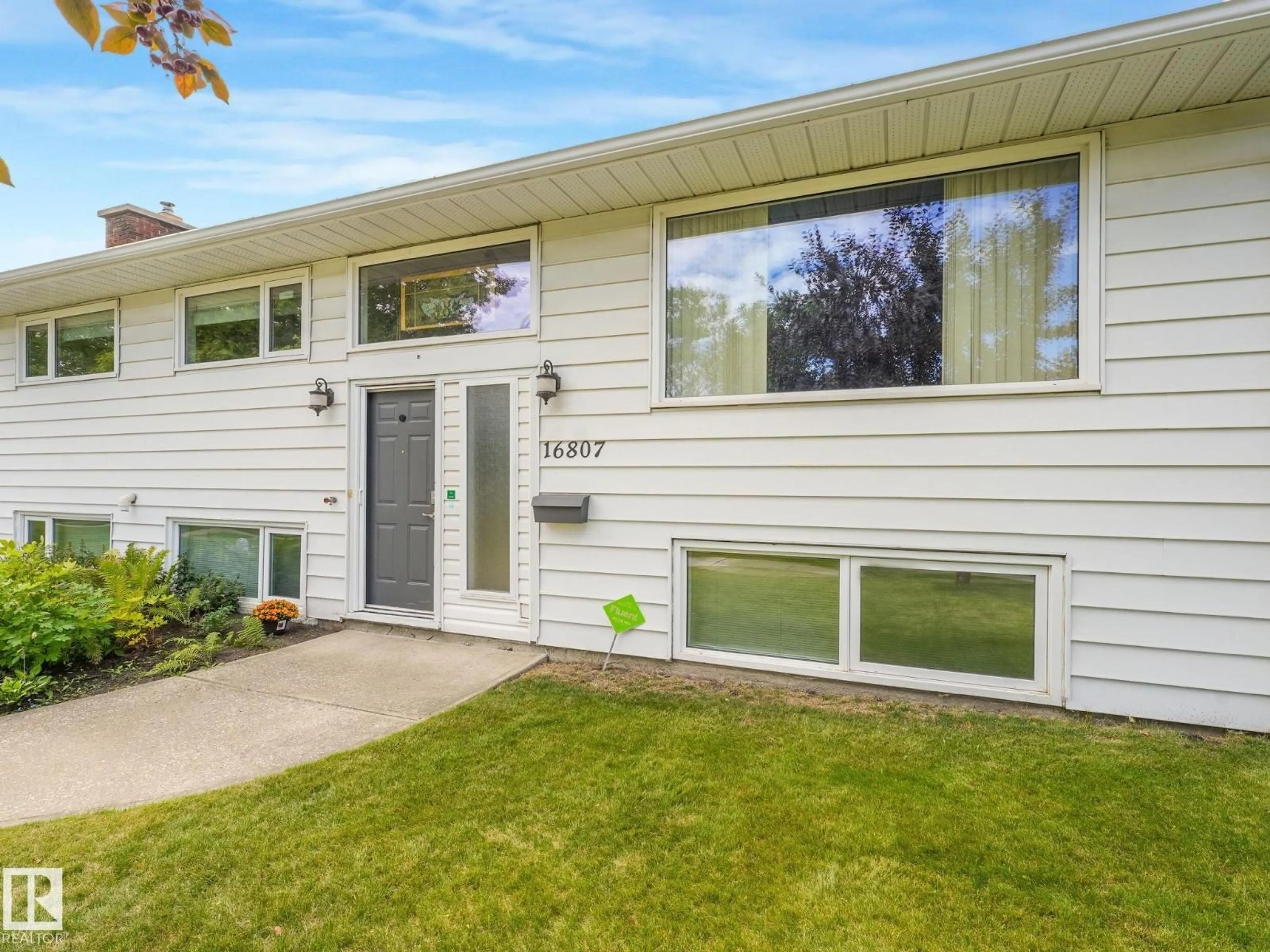 Home with vinyl exterior material, street for 16807 80 AV, Edmonton Alberta T5R3N1