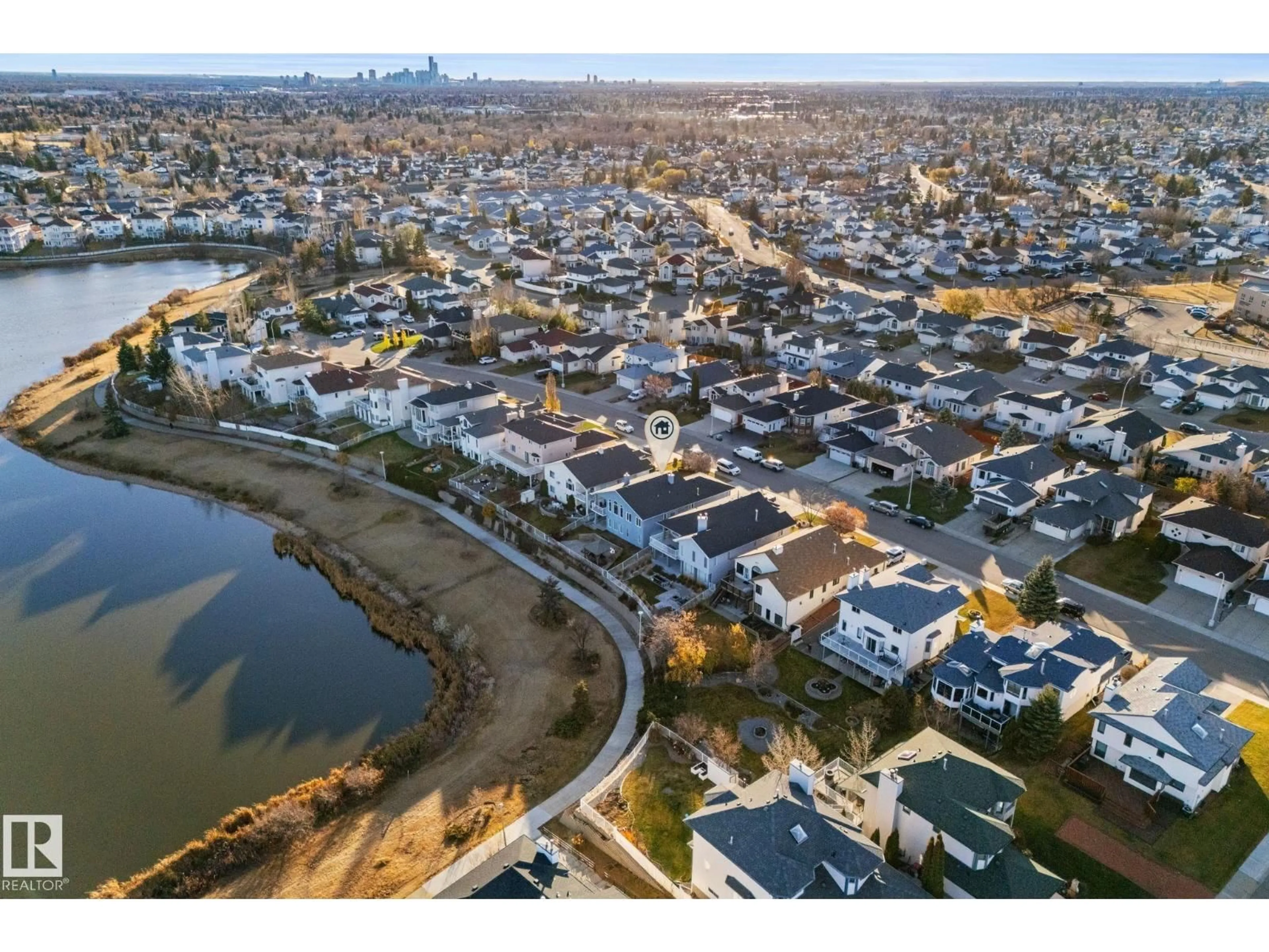 A pic from outside/outdoor area/front of a property/back of a property/a pic from drone, water/lake/river/ocean view for 15919 58 ST NW, Edmonton Alberta T5Y2R5