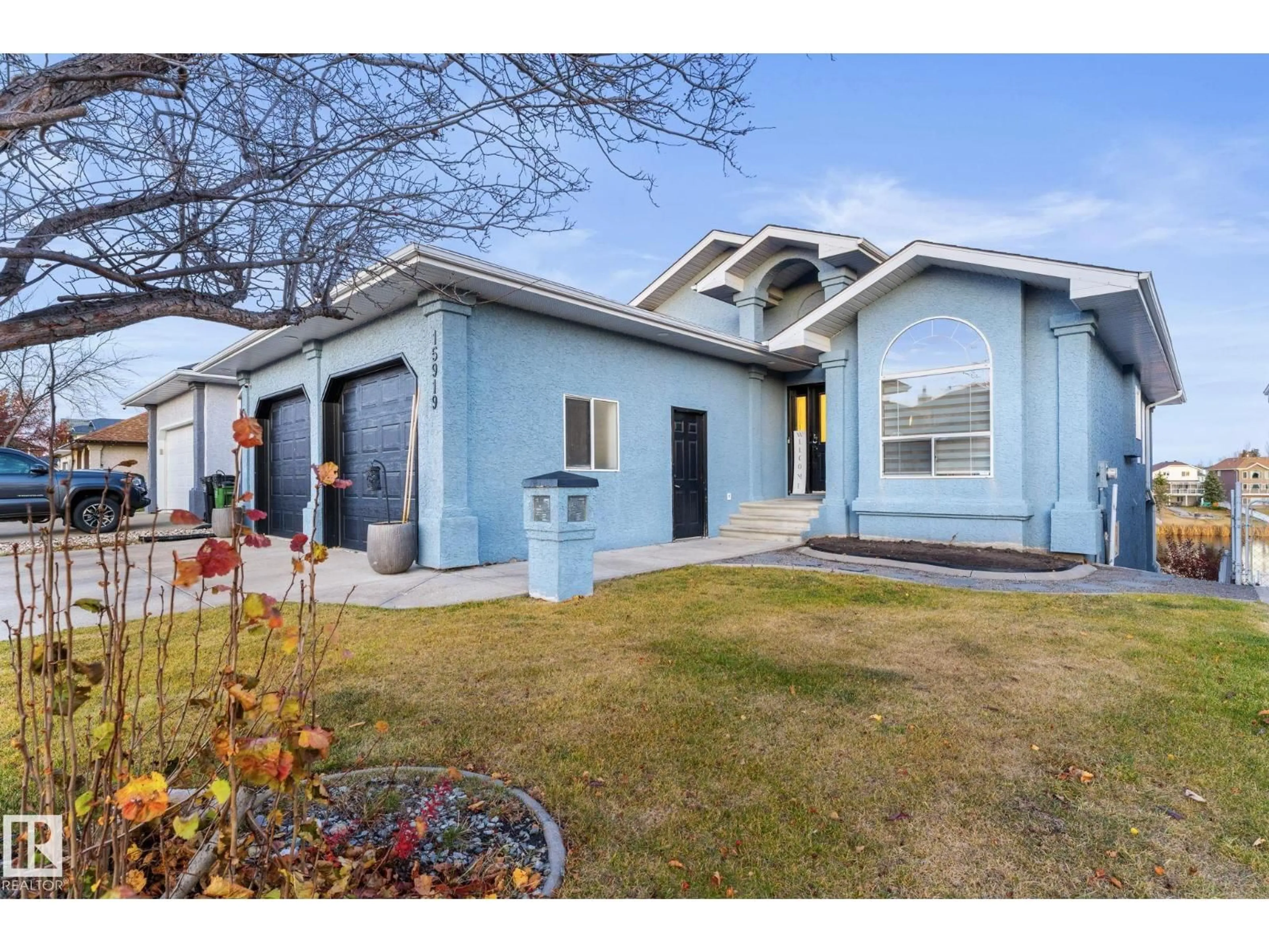 Home with vinyl exterior material, street for 15919 58 ST NW, Edmonton Alberta T5Y2R5