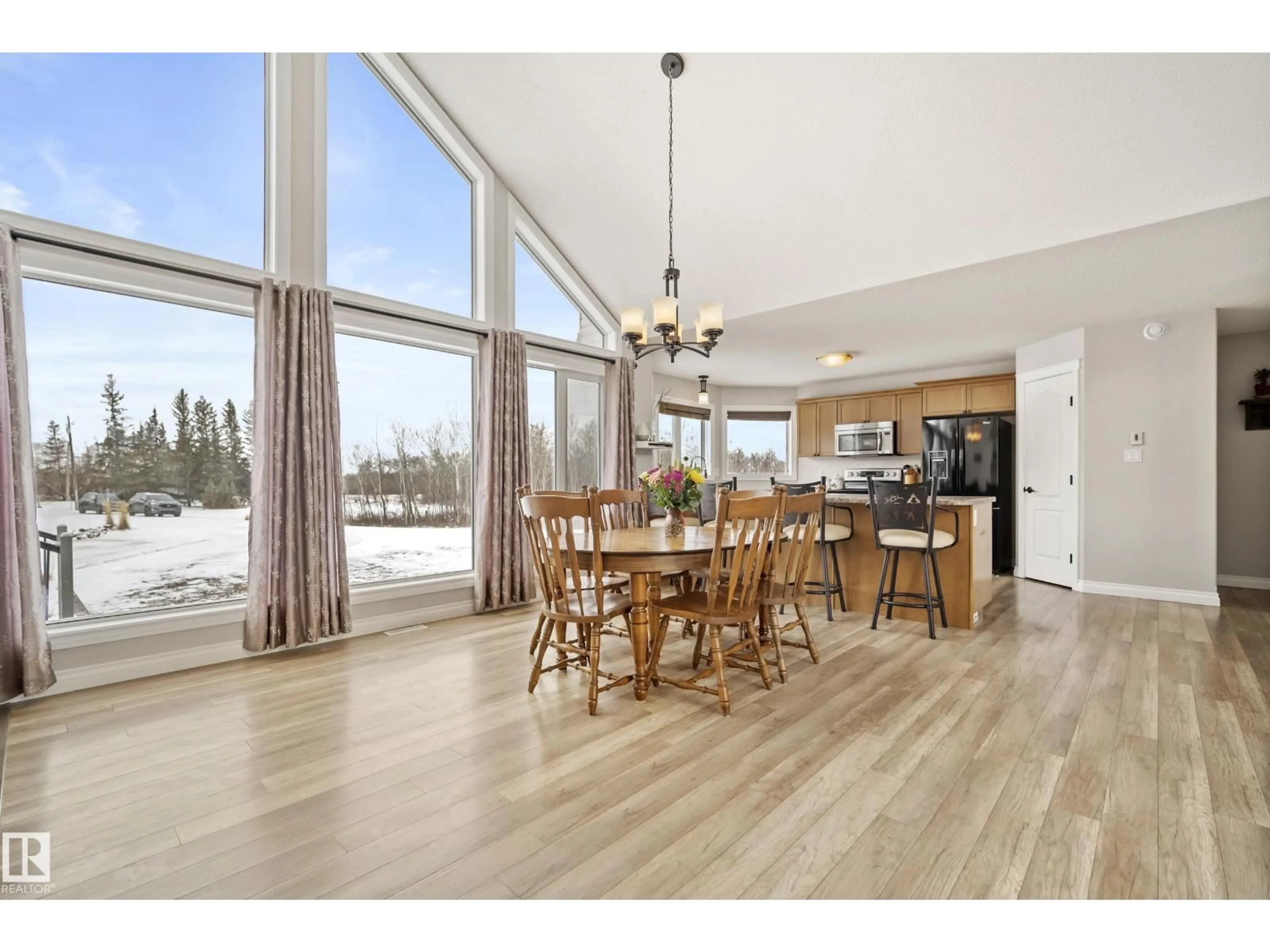 Open concept kitchen, wood/laminate floor for 1290 50242 RGE RD 244, Rural Leduc County Alberta T4X0P4