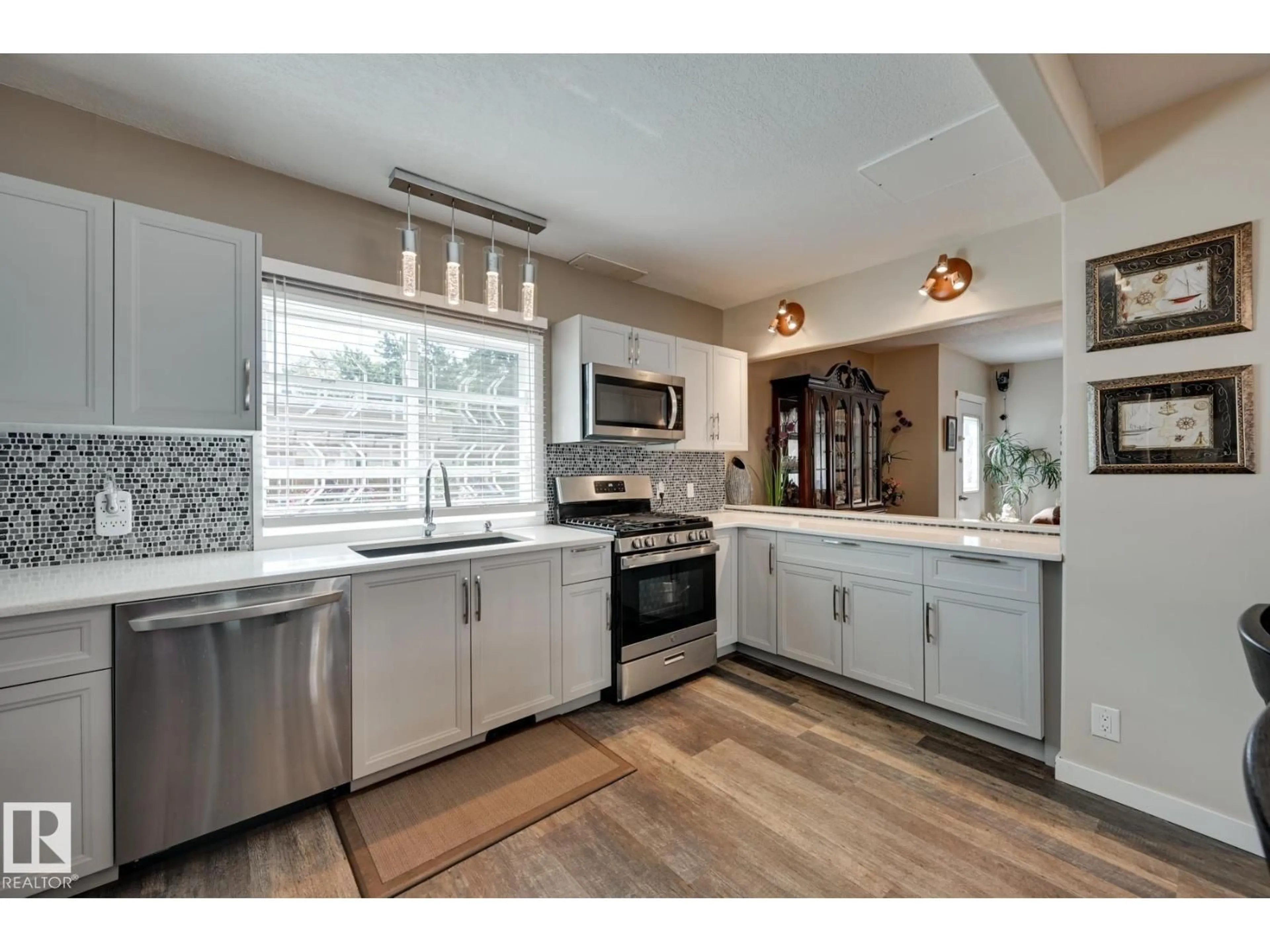 Open concept kitchen, ceramic/tile floor for 5039 52 ST, Andrew Alberta T0B0C0