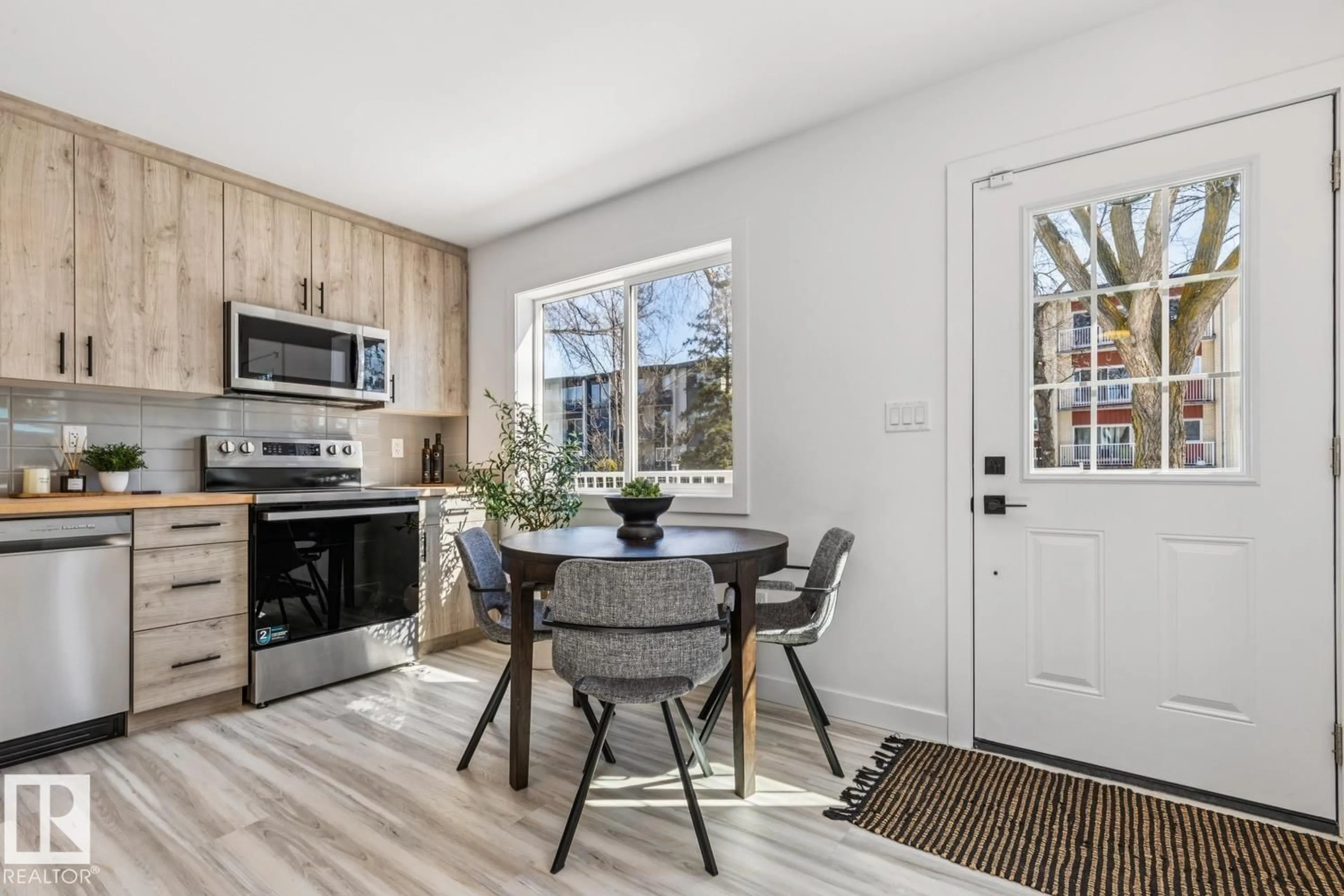 Open concept kitchen, wood/laminate floor for NW - 10726 107 ST, Edmonton Alberta T5H2Z1