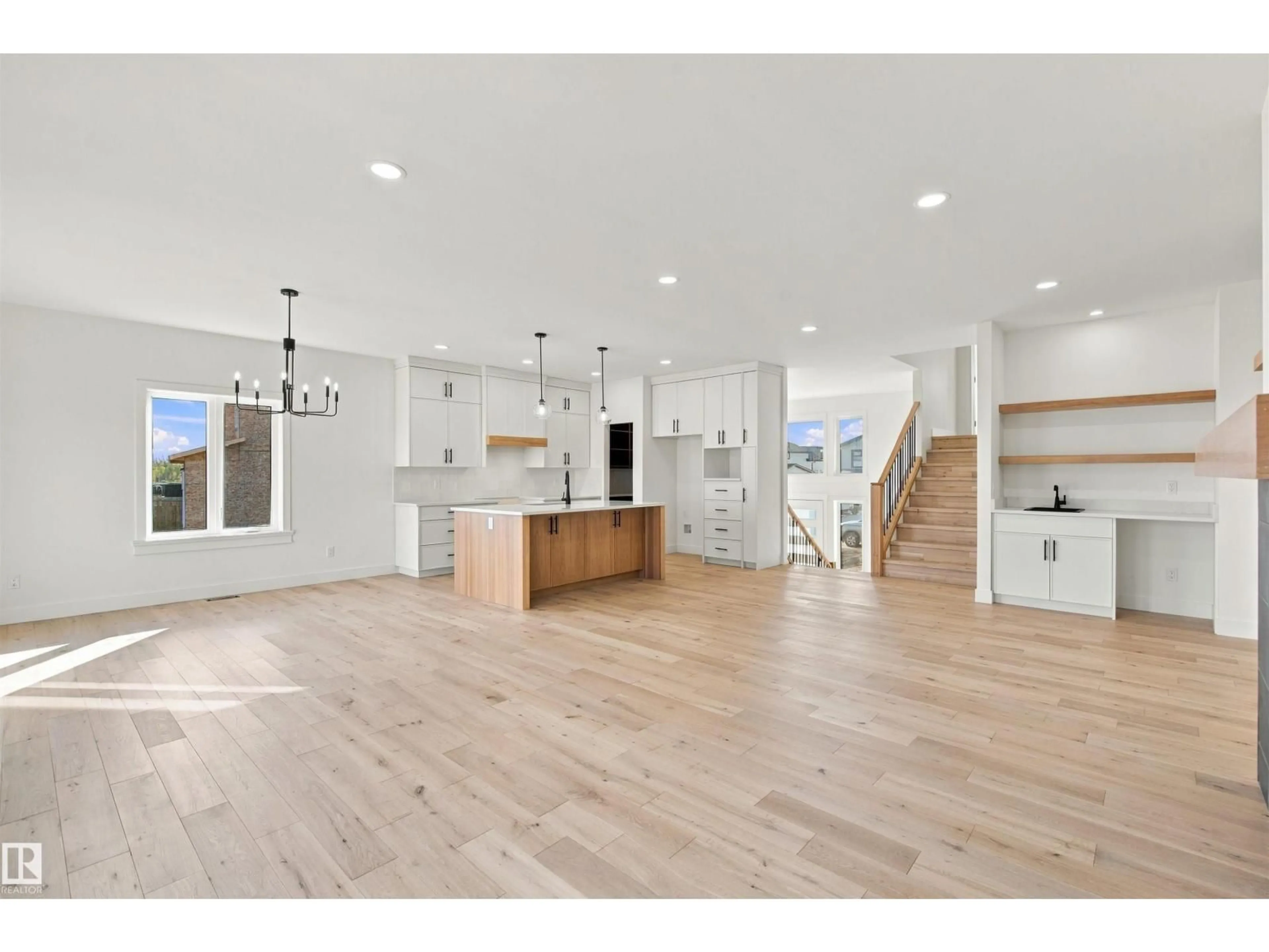 Open concept kitchen, wood/laminate floor for 319 FUNDY WY, Cold Lake Alberta T9M0M4