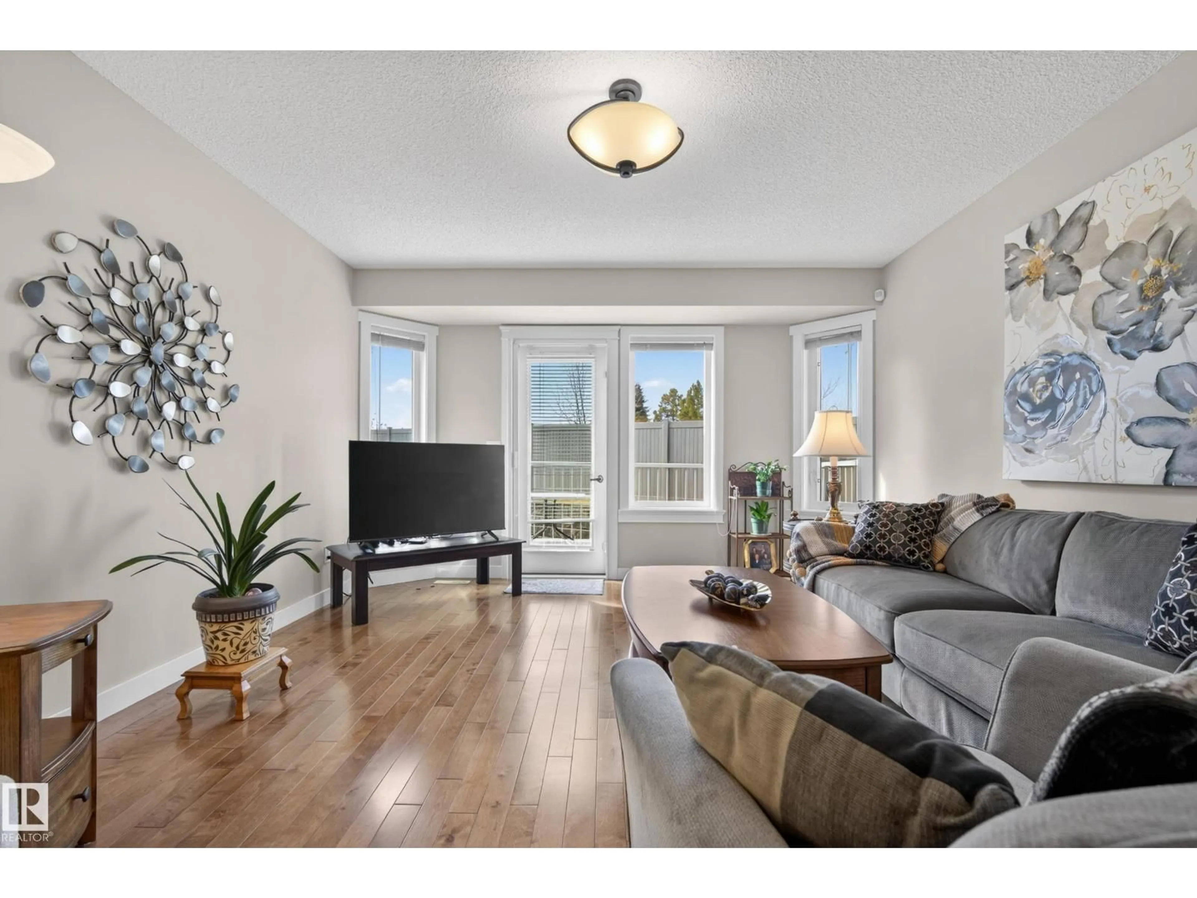 Living room with furniture, wood/laminate floor for 49 - 40 COLWILL BV, Sherwood Park Alberta T8A6C3