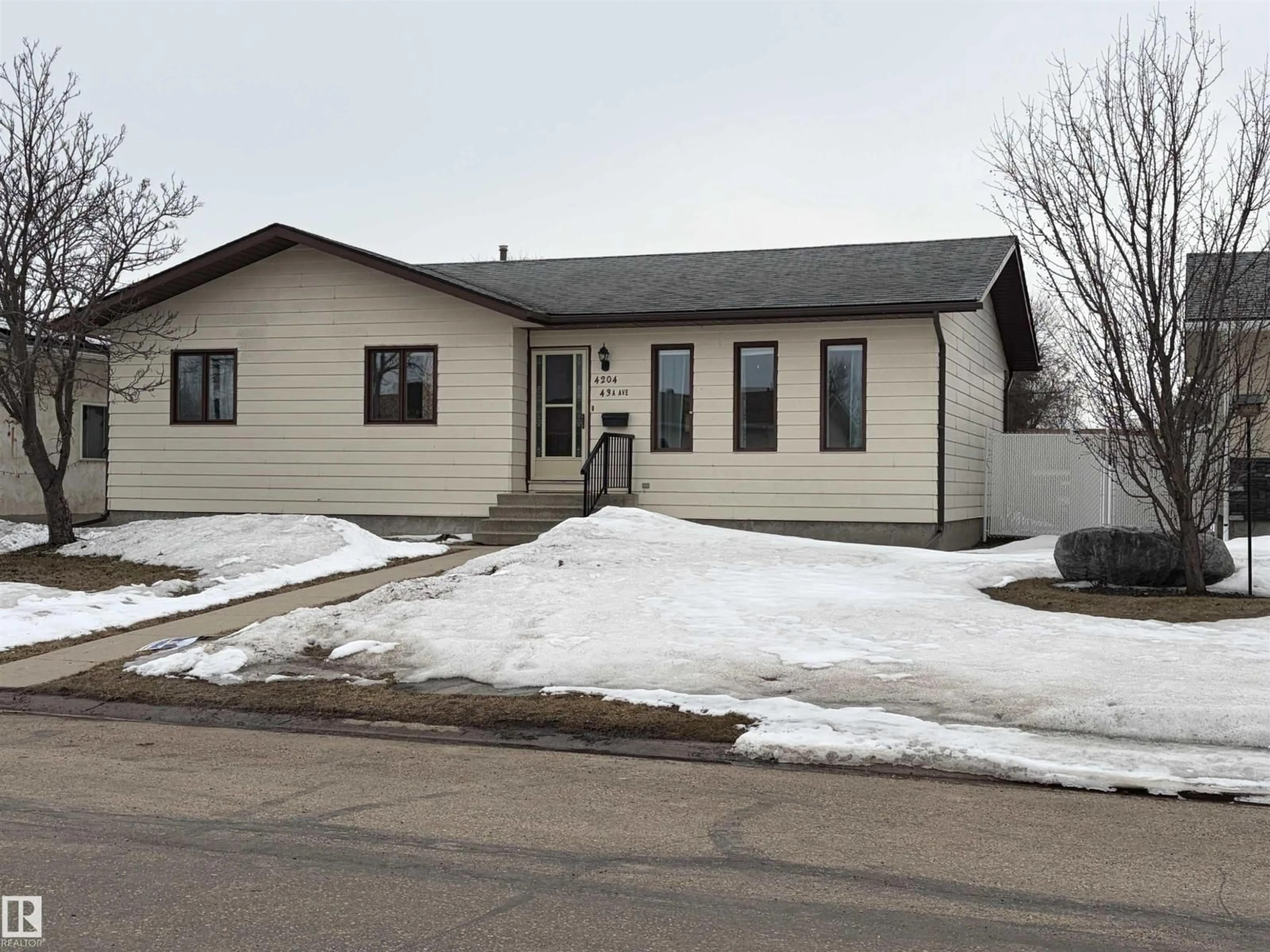 Home with vinyl exterior material, street for 4204 43A AVE, Bonnyville Town Alberta T9N1W7