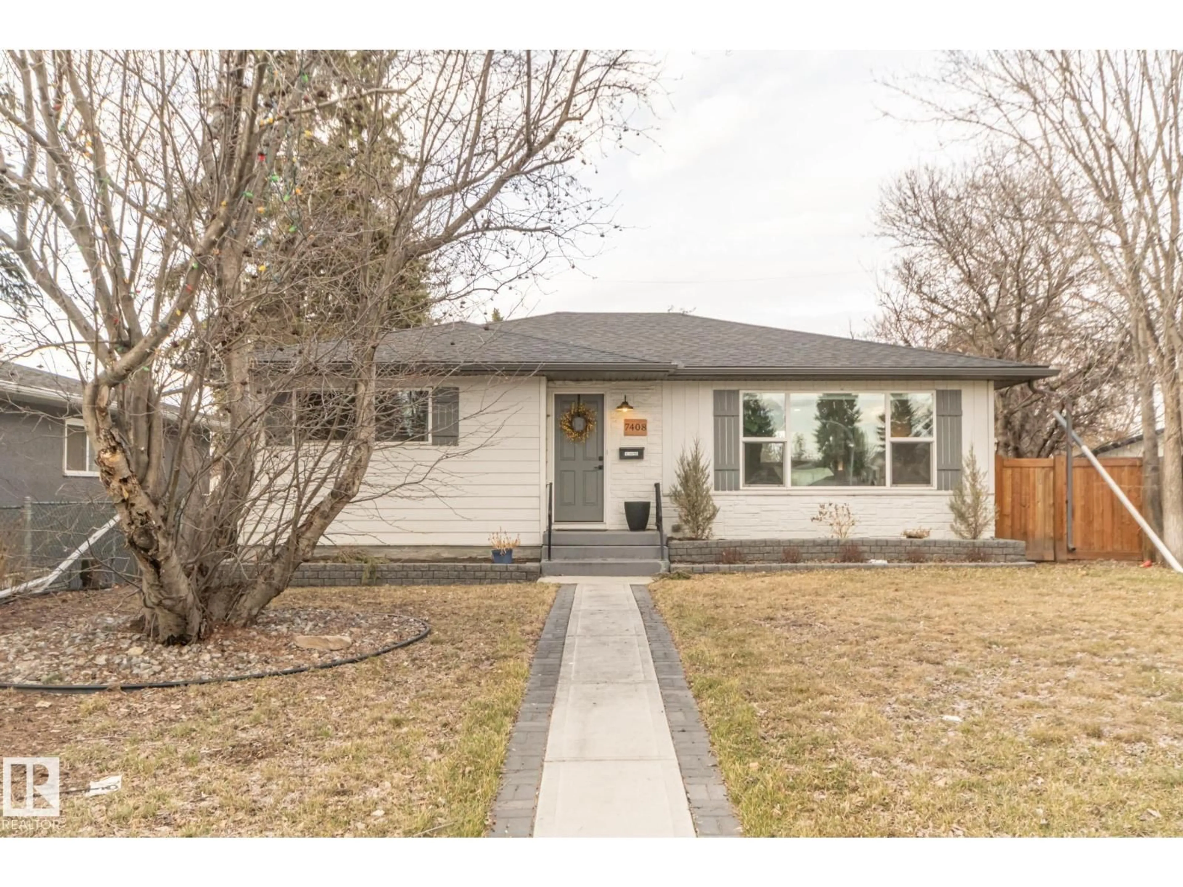 Home with brick exterior material, street for 7408 92 AV, Edmonton Alberta T6B0S7