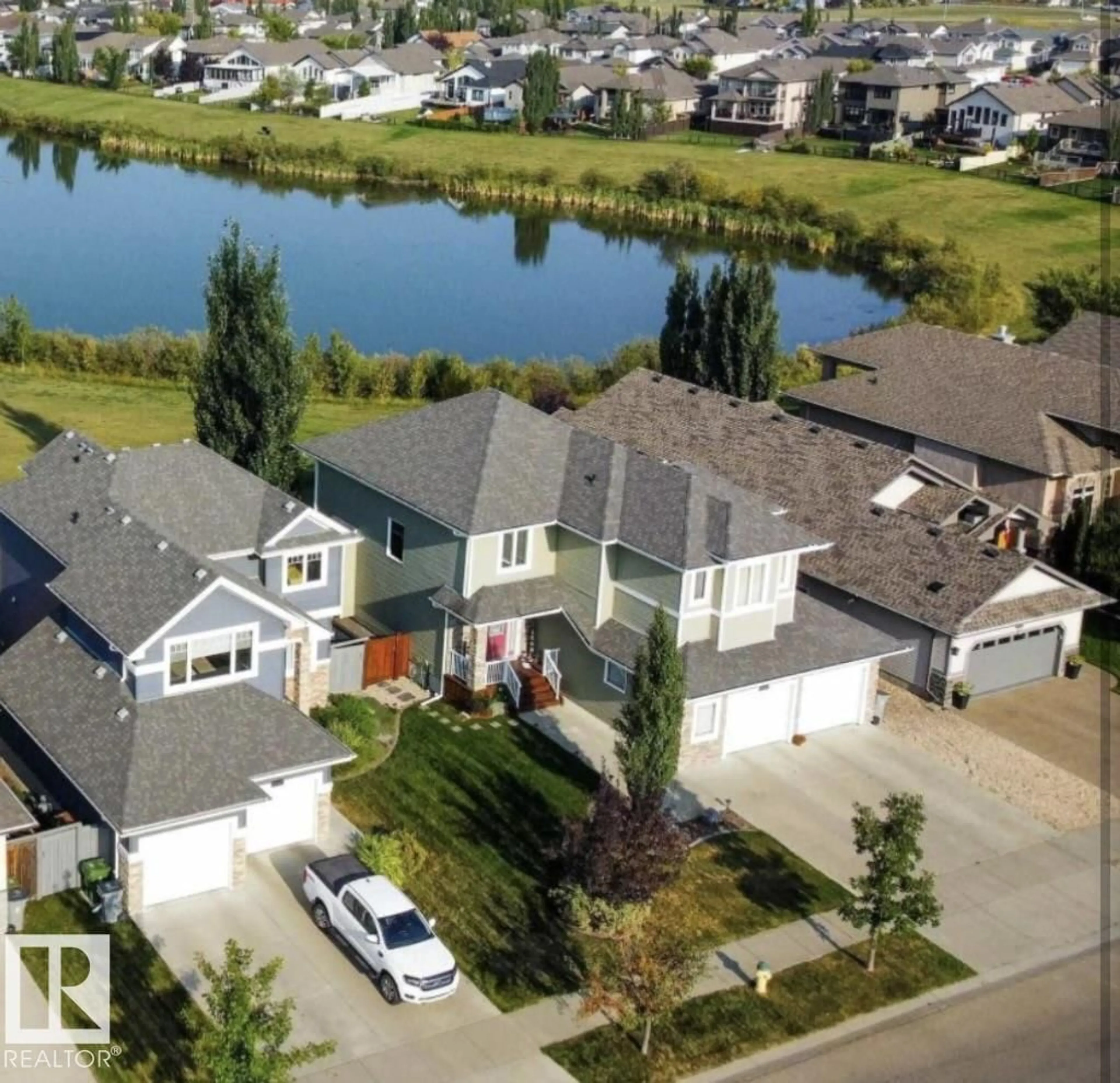 A pic from outside/outdoor area/front of a property/back of a property/a pic from drone, water/lake/river/ocean view for 10417 97 ST, Morinville Alberta T8R0B8