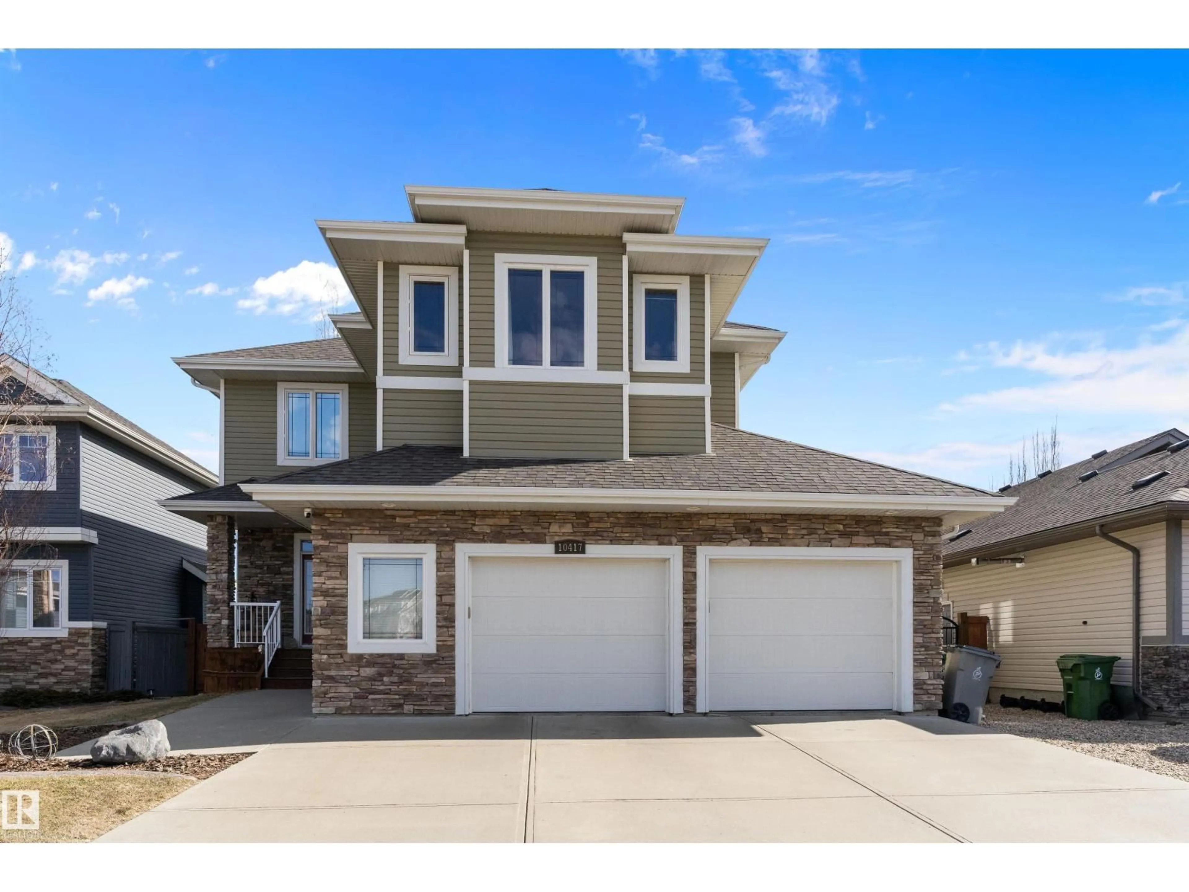 Home with vinyl exterior material, street for 10417 97 ST, Morinville Alberta T8R0B8