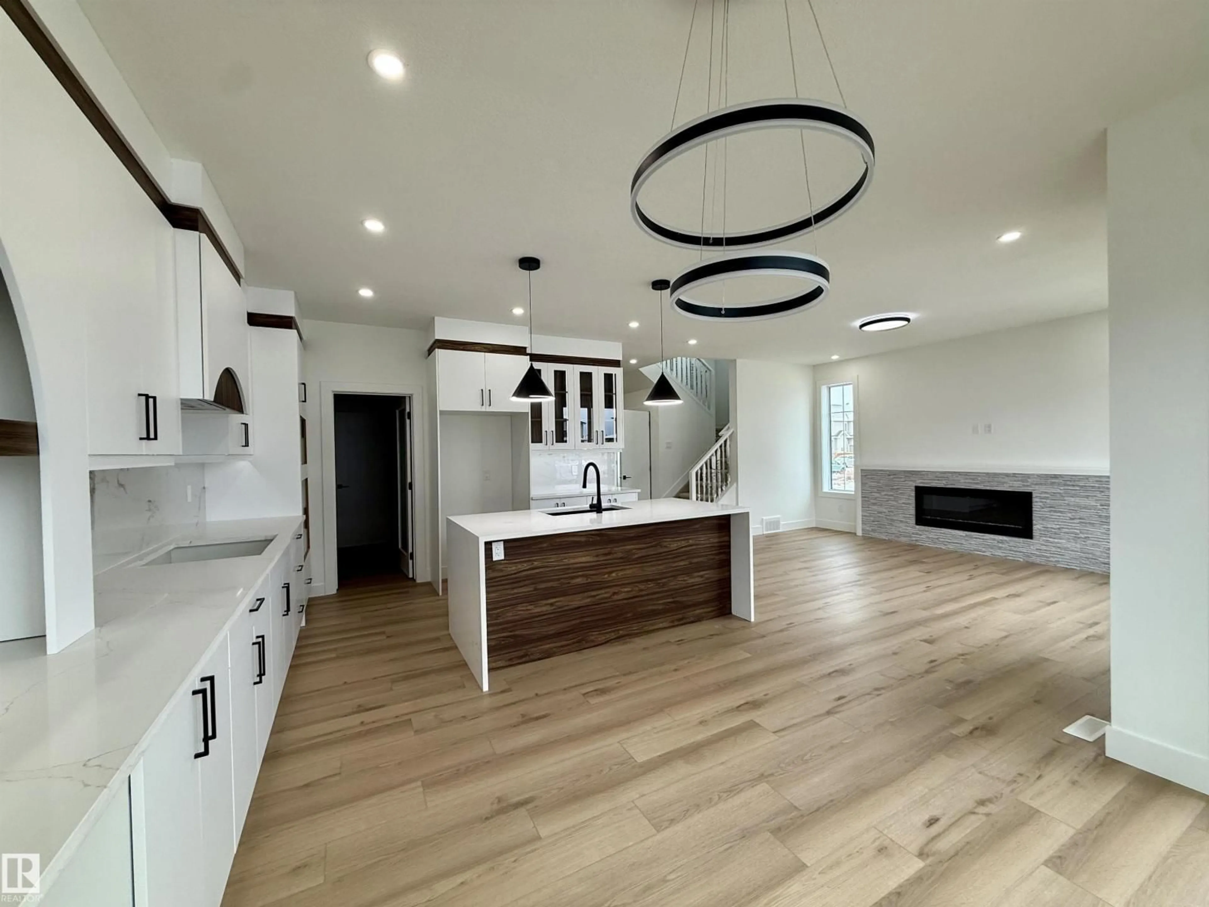 Open concept kitchen, wood/laminate floor for 5802 PELTIER CL, Beaumont Alberta T4X2Y1