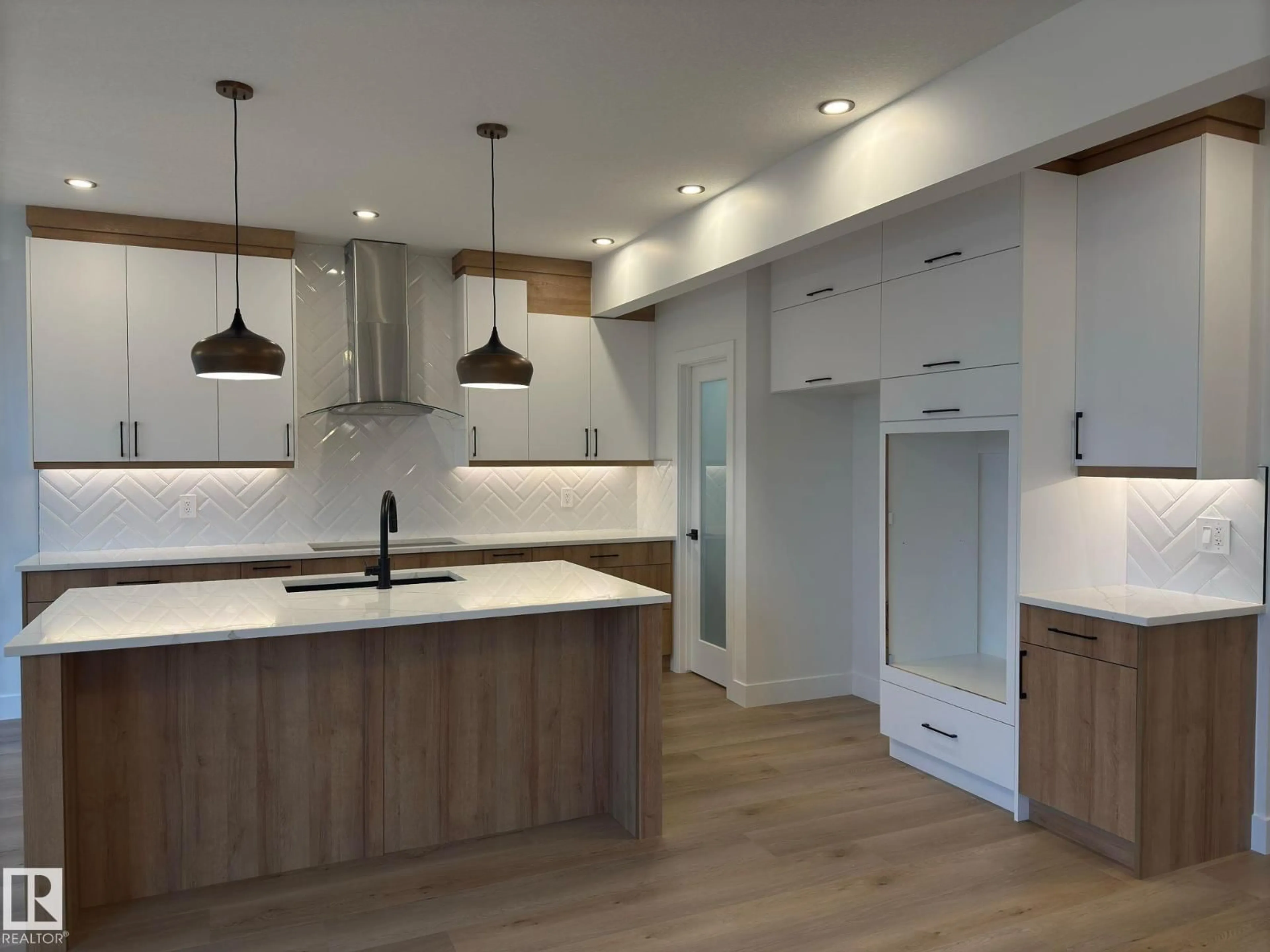 Open concept kitchen, wood/laminate floor for 5001 46 ST, Redwater Alberta T5K2J1