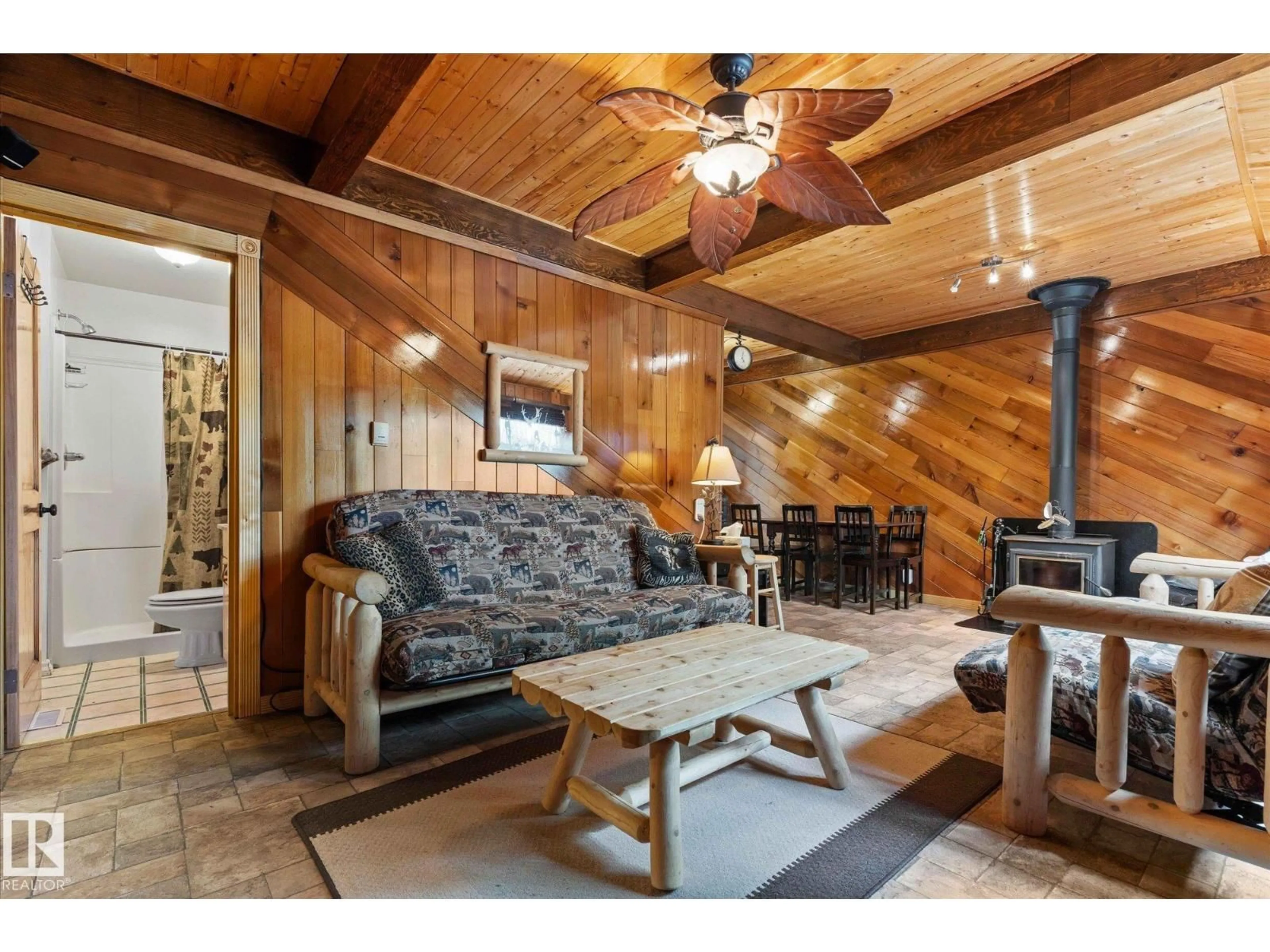 Living room with furniture, wood/laminate floor for 1028-1029 10 ST, Rural Lac Ste. Anne County Alberta T0E0A2